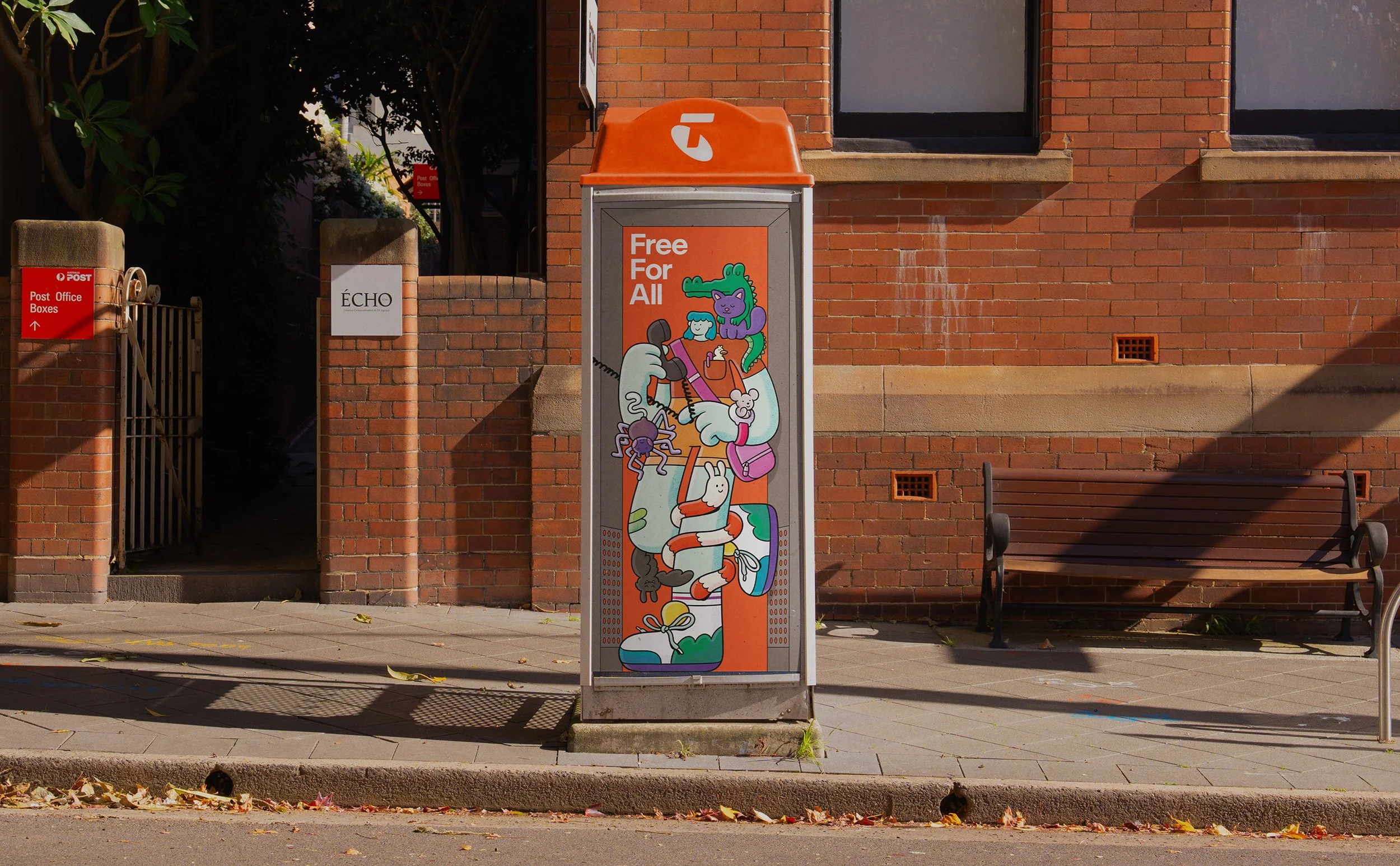 Brosmind character artwork on a Telstra phone booth, featuring an adventurous girl surrounded by fun climbing animals.