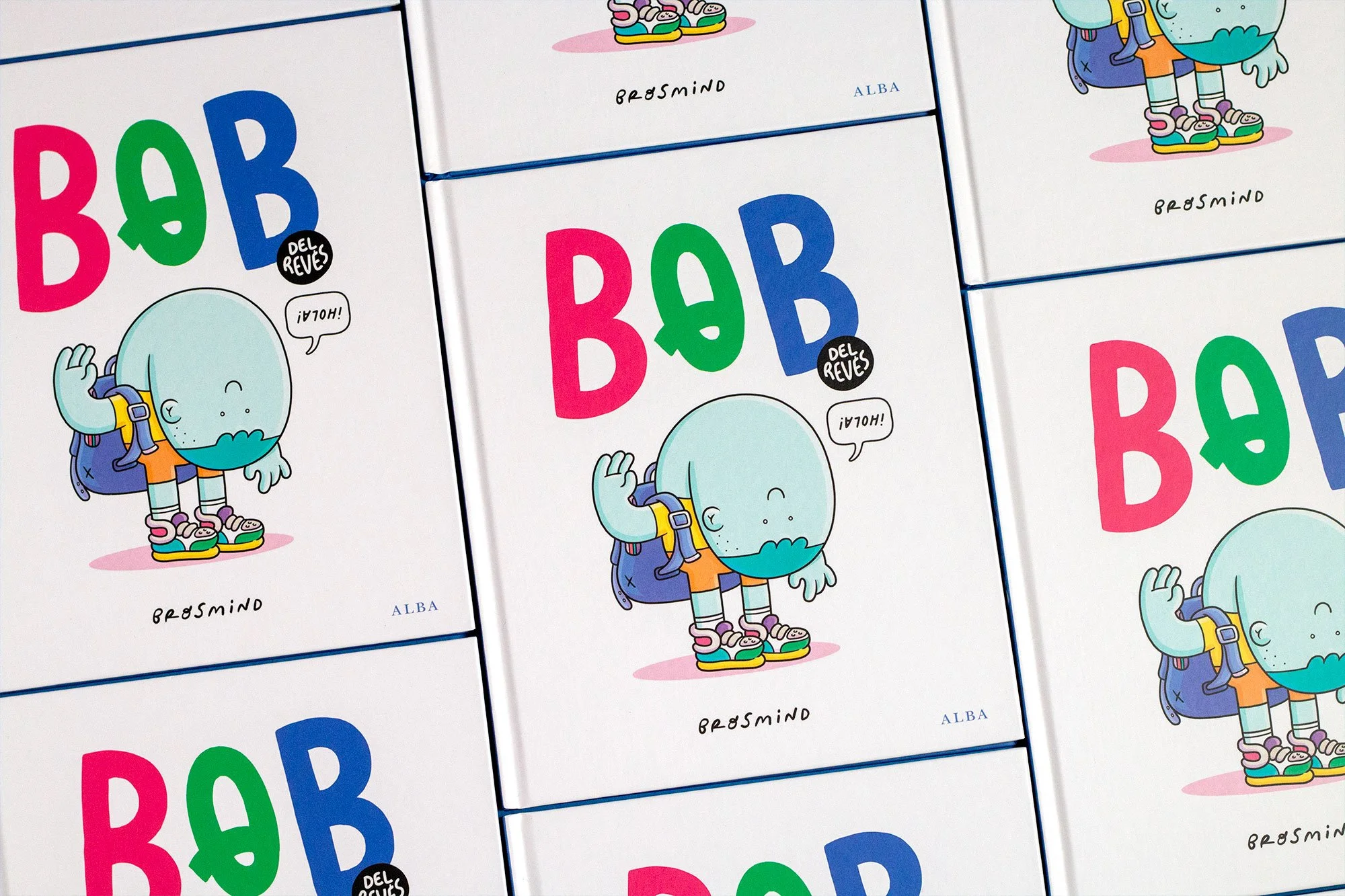 Grid photography of multiple copies of the Bob Upside Down illustrated children's book by Brosmind, published by ALBA Editorial.