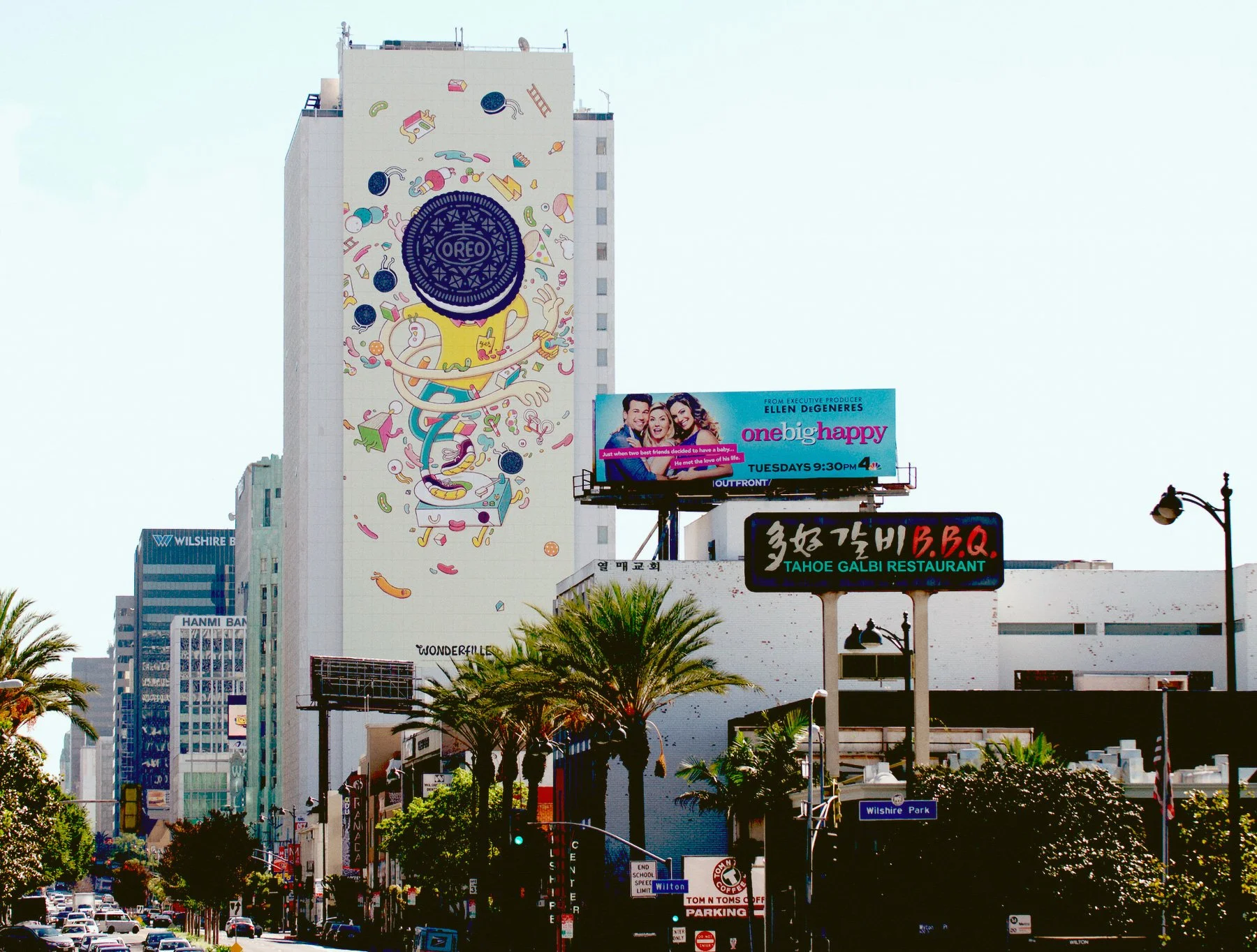 Massive outdoor billboard advertisement for Oreo featuring Brosmind art on a skyscraper in a US city street.