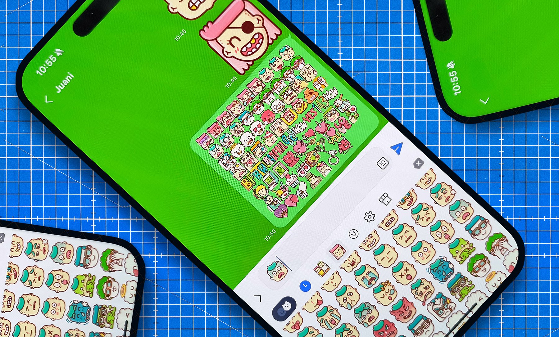 Top view of smartphones displaying custom LINE app messaging emojis designed by Brosmind on a blue workspace.