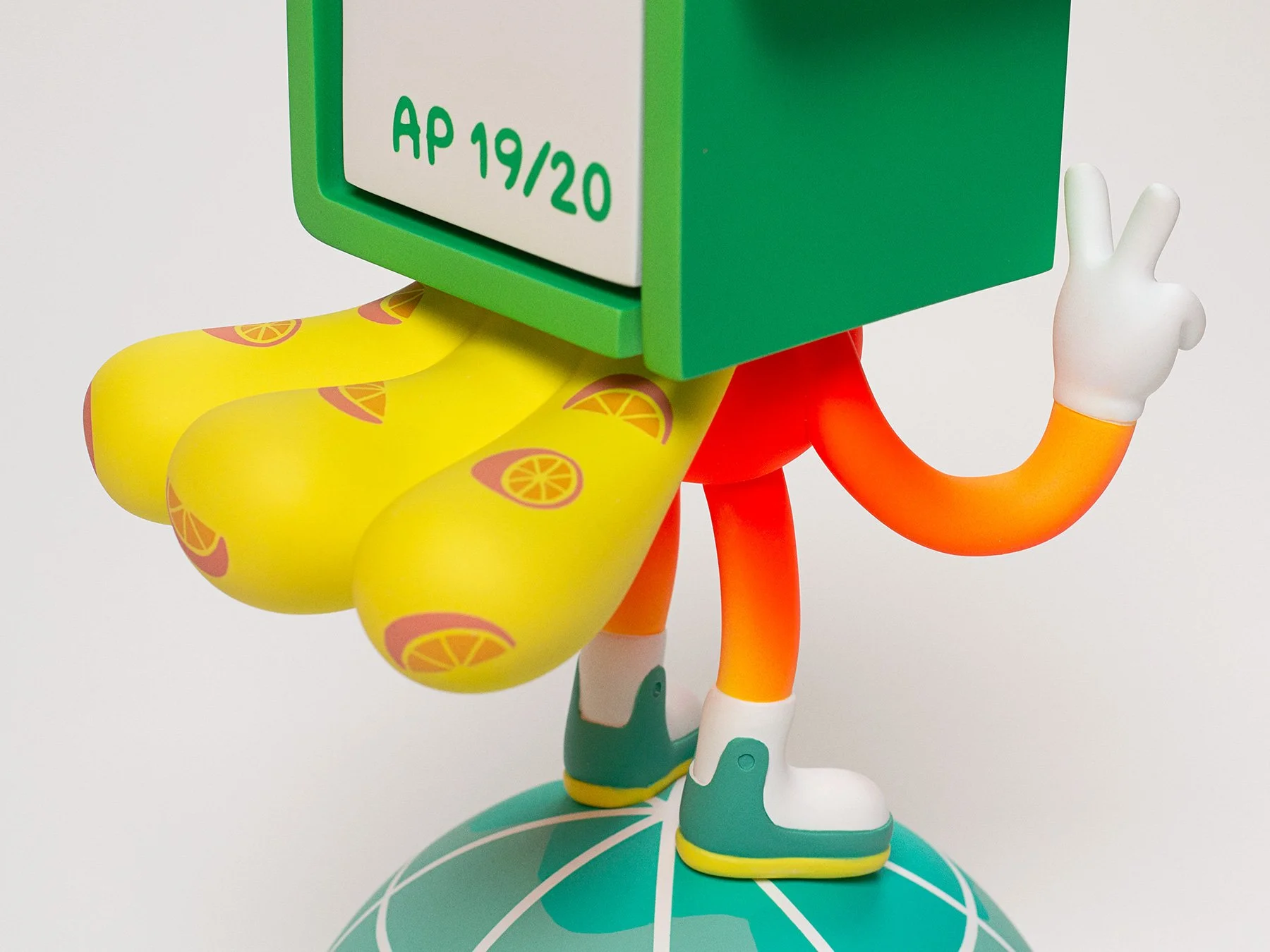 Back view photo of the DaYung's character sculpture showing a puffy, inflatable-style yellow cape.