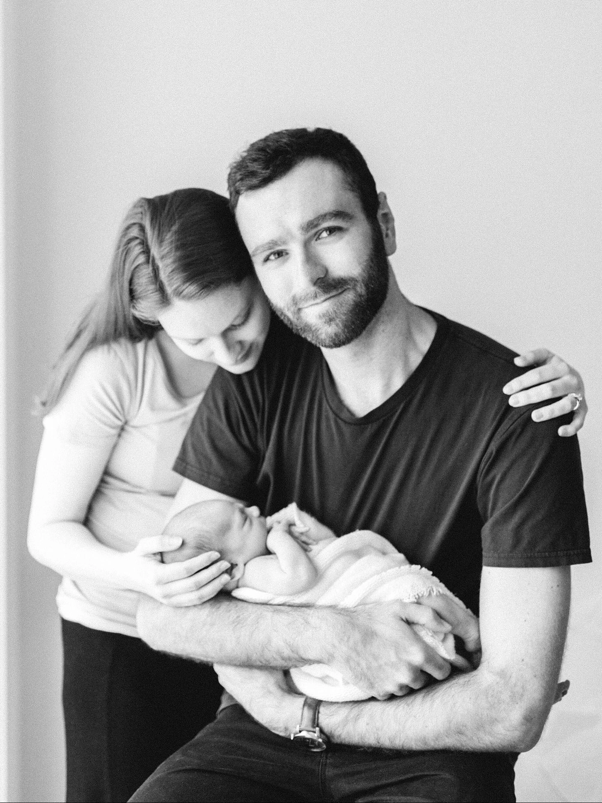  This photo stopped me in my tracks when I saw it. Just, the look on his face makes me melt. So content, and full of love and joy - not exuberant joy, just the quiet kind that comes from a deep place of gratitude.   