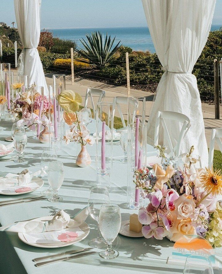 Pastel iridescence by the sea 💫⁠
⁠
⁠
⁠Photography: @dakaiphotography⁠
Planning &amp; Design: @nicolelezadesign⁠
Videography: @christackphoto⁠
Floral: @anniereddcreative⁠
Lighting: @drapingbykim⁠
DJ: @lefunksounds⁠
Signage: @roseandwrench⁠
Linens: @b