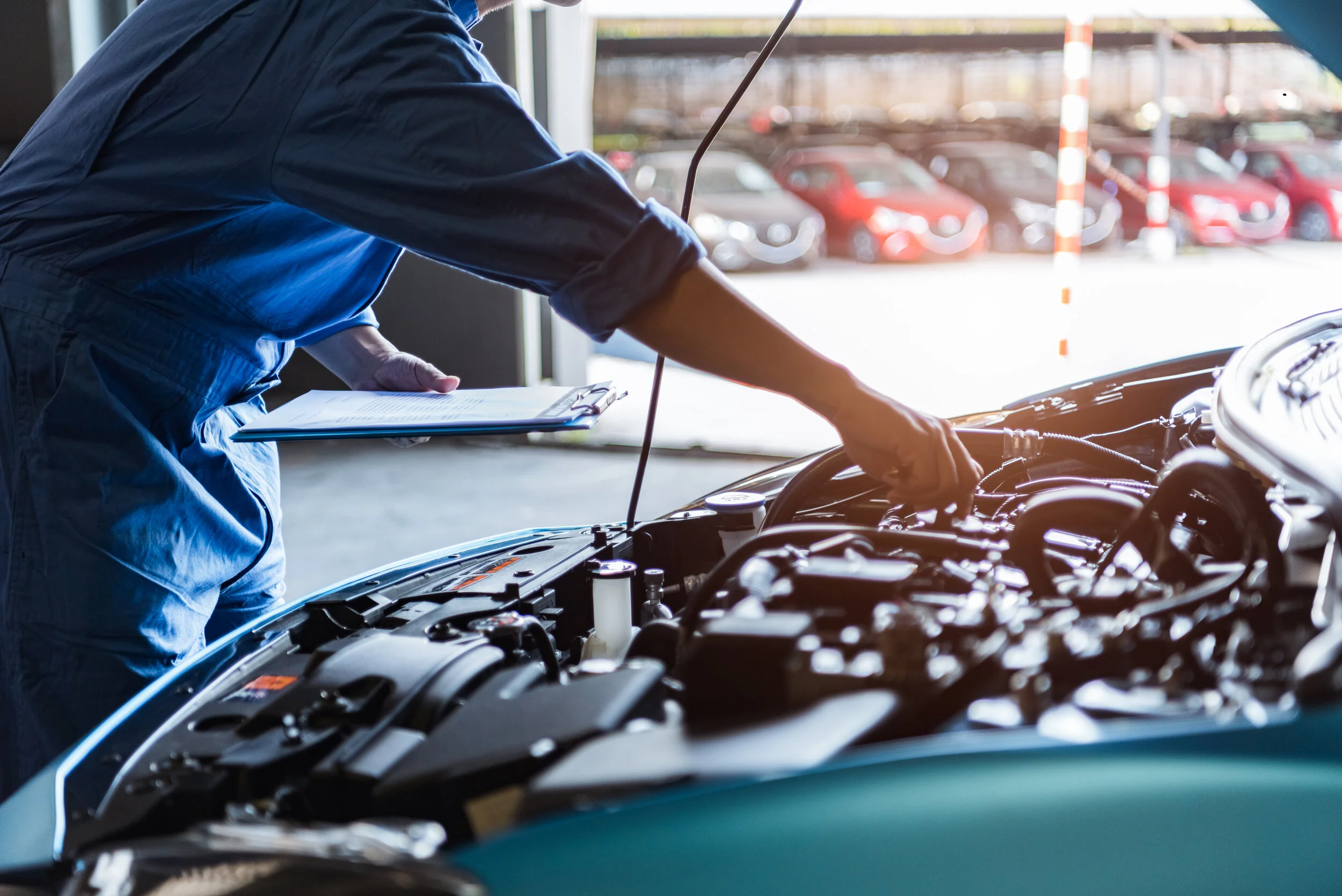 Car-mechanic-holding-clipboard-and-checking-to-maintenance-vehicle-by-customer-claim-order-in-auto-repair-shop-garage.-Engine-repair-service.-People-occupation-and-business-job.-Automobile-technician-1219905269_6016x4016.jpeg