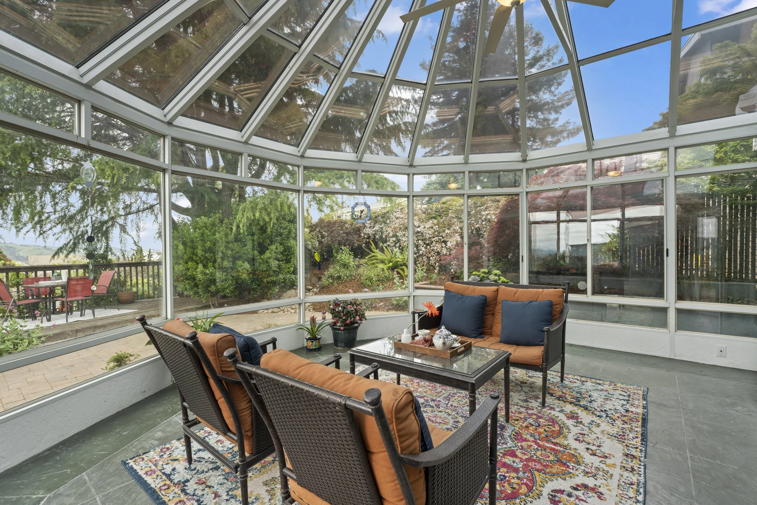 Style it Staging turned a cluttered sunroom into a welcoming space.  This stunner of a room will now help to sell this home for more money. 