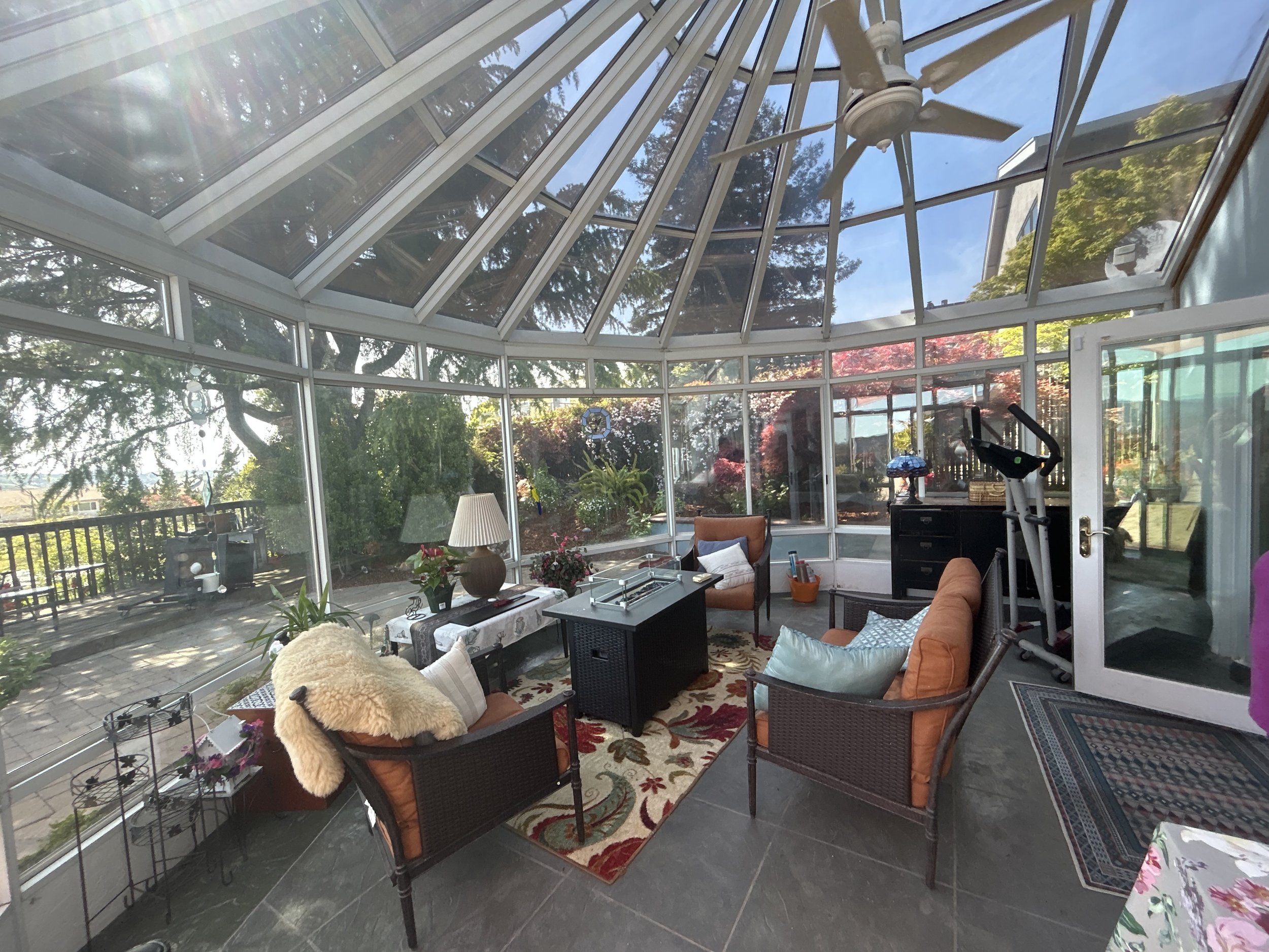 Sunroom, greenhouse room was cluttered with furniture before Style it Staging.