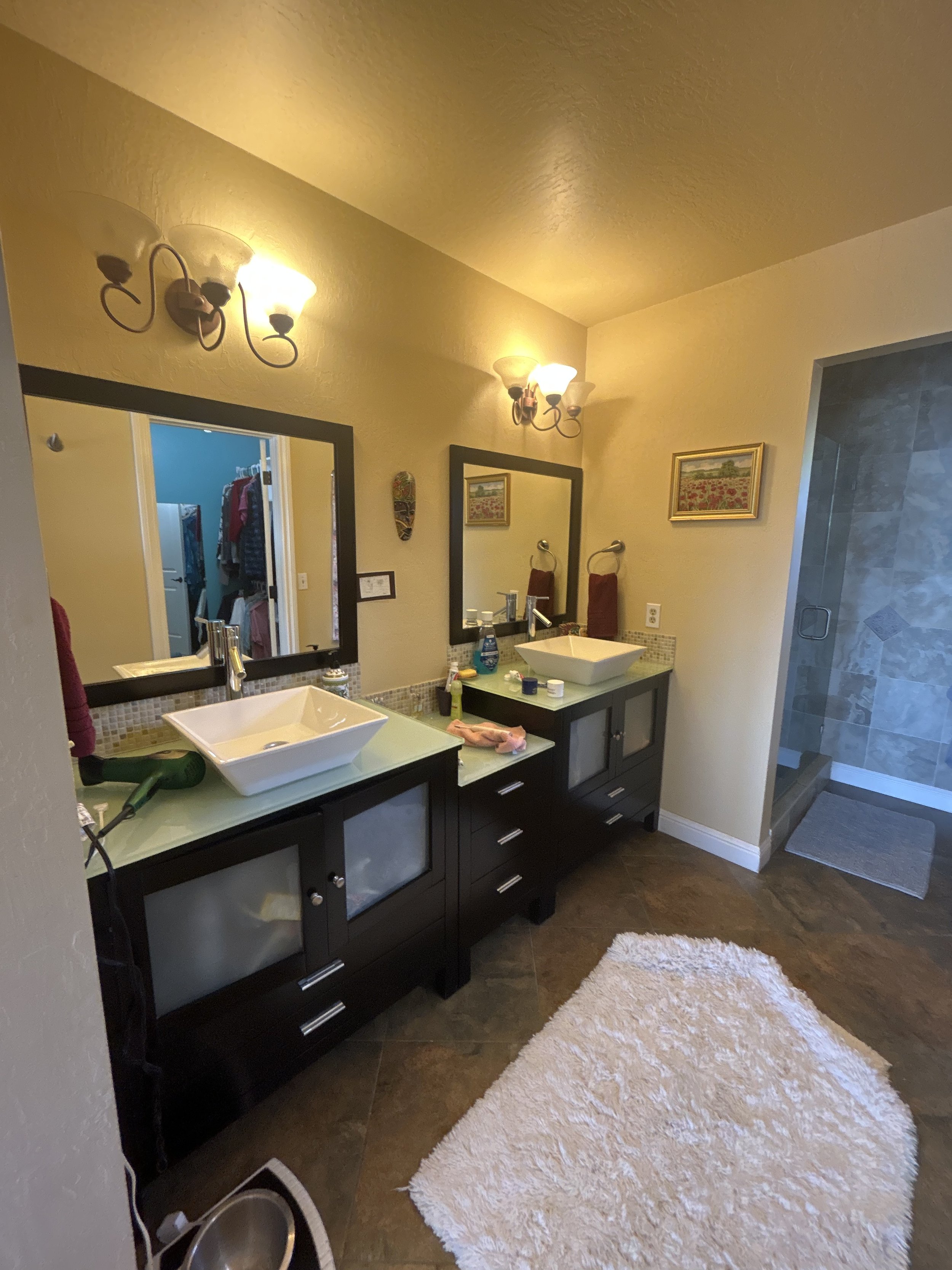 This is a beautiful double sink bathroom that wasn't displaying well in photos. House staging will help improve this space.