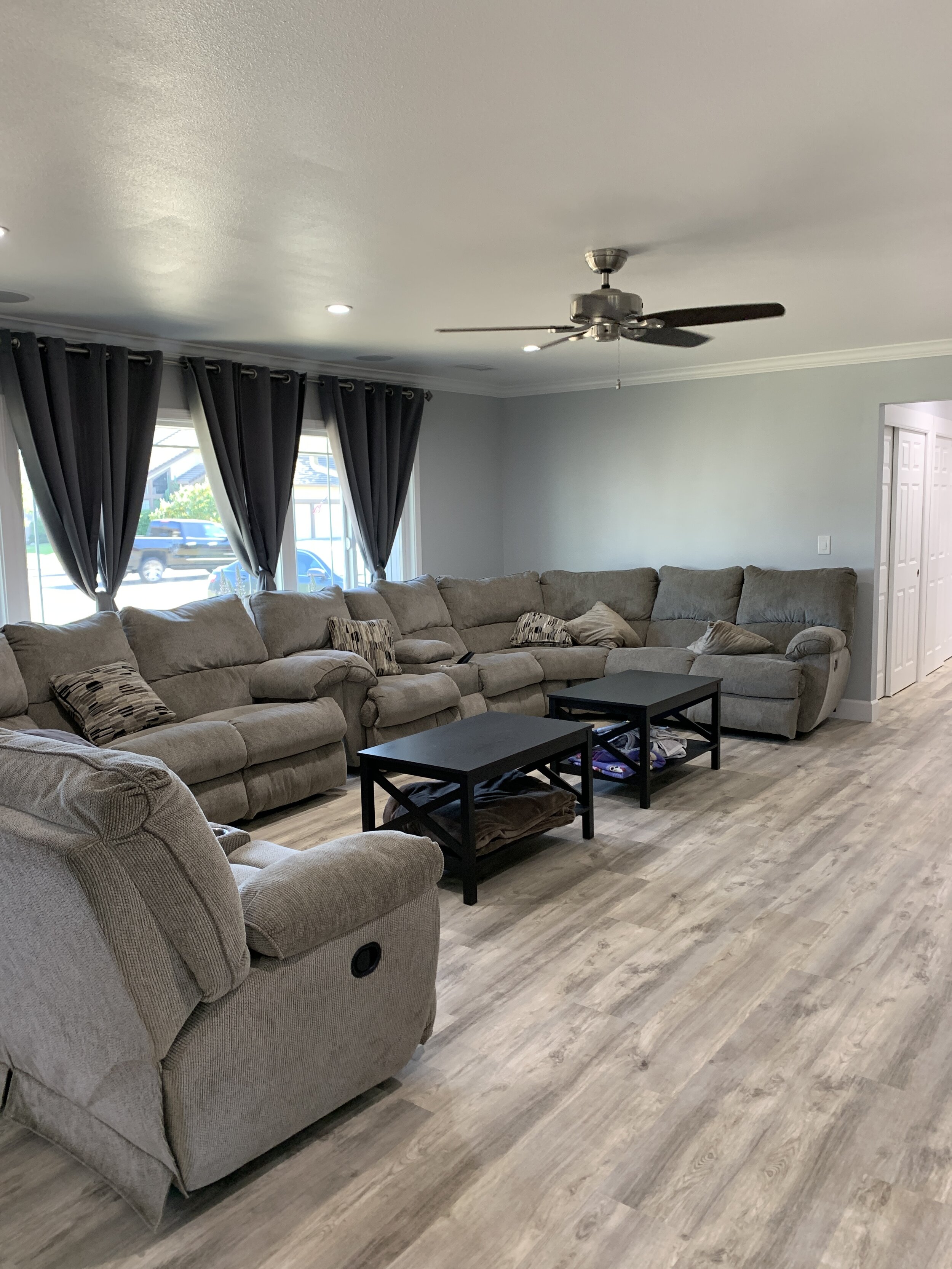 Before Style it Staging home staging services. Huge couch too bulky for room. Dark oversized curtains