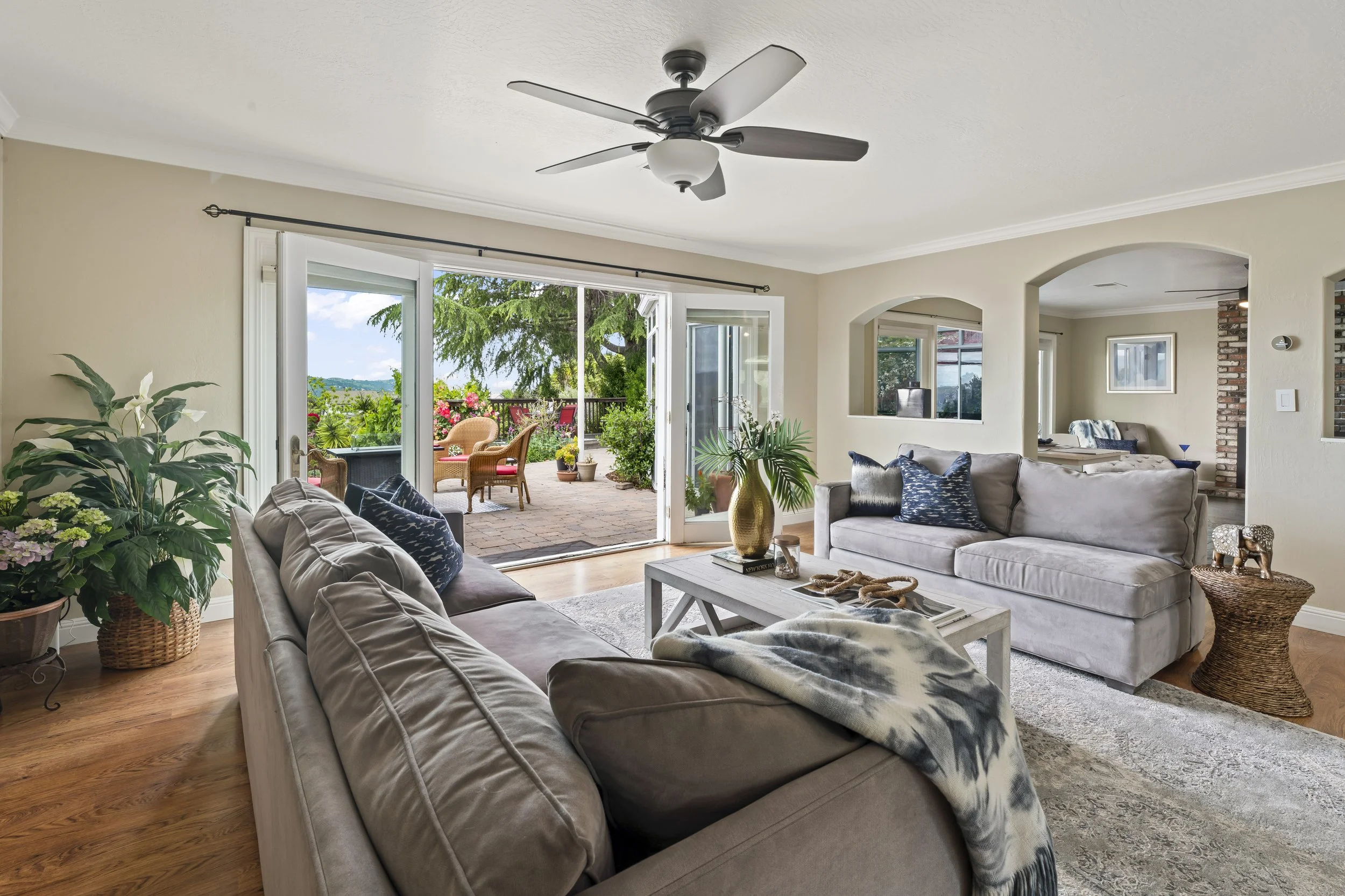 Couches opposite each other in this living room space opens up and improves the flow of the room. Thanks to Style it Staging 