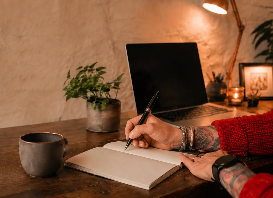 A woman looking at a laptop containing an audit report