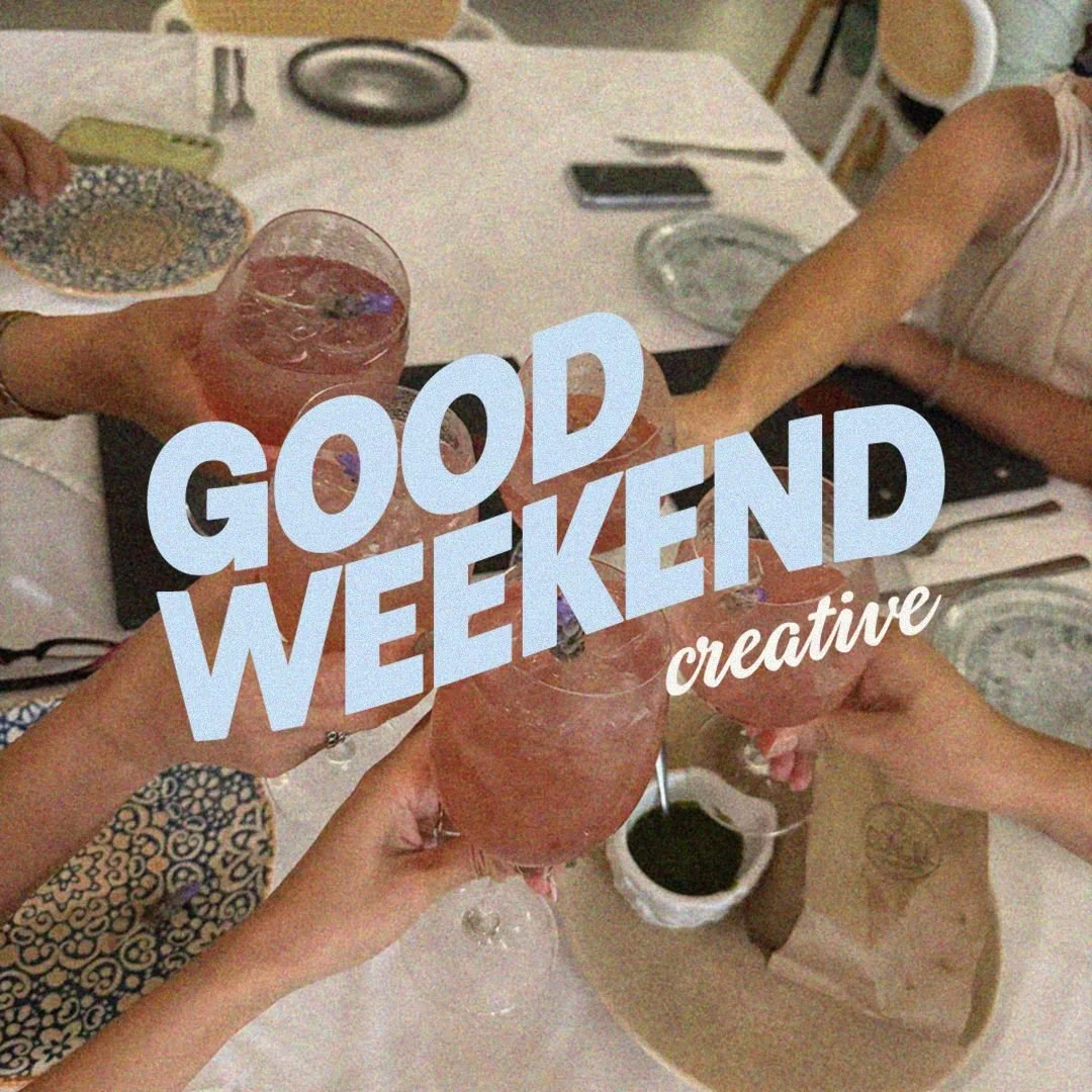 Four people at a dining table raising glasses of pink drinks for a toast, with the text 'Good Weekend Creative' overlaid on the image.