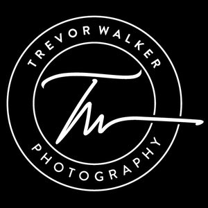 A circular logo with the text 'Trevor Walker Photography' around the border and a stylized signature in the center.