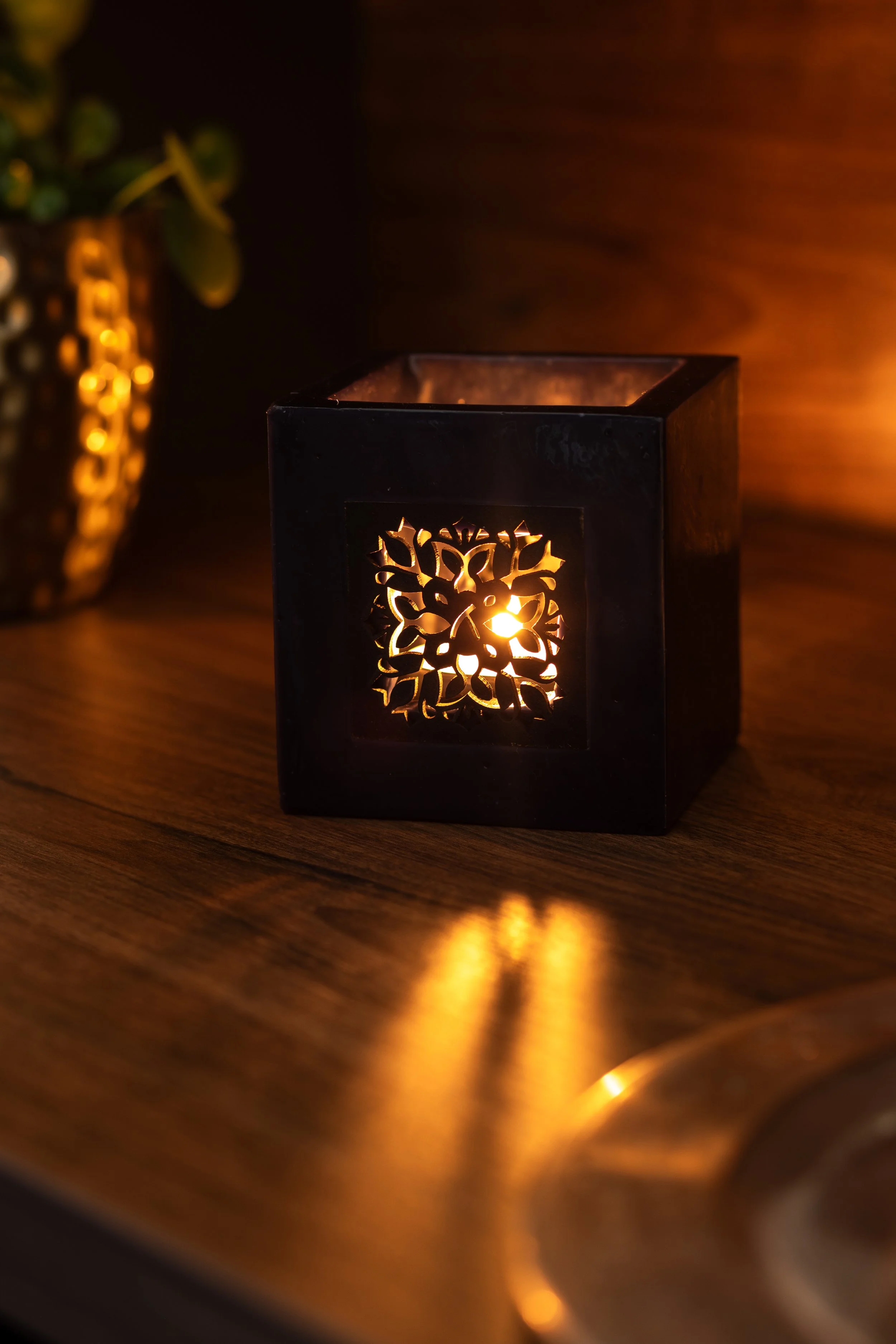 Lifestyle product - black candle holder - photo showing item being used in real setting