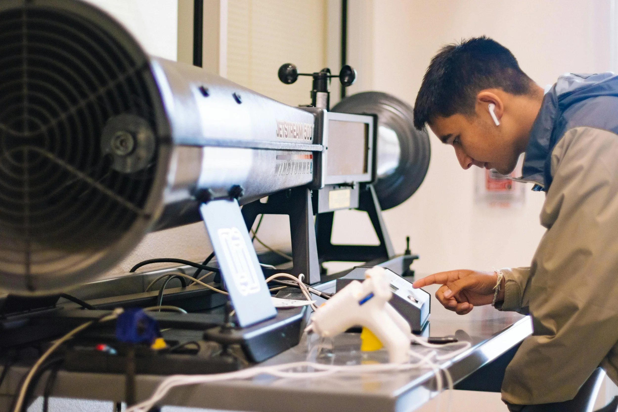 Engineering student working independently with lab equipment in a small, teaching-centered instructional setting