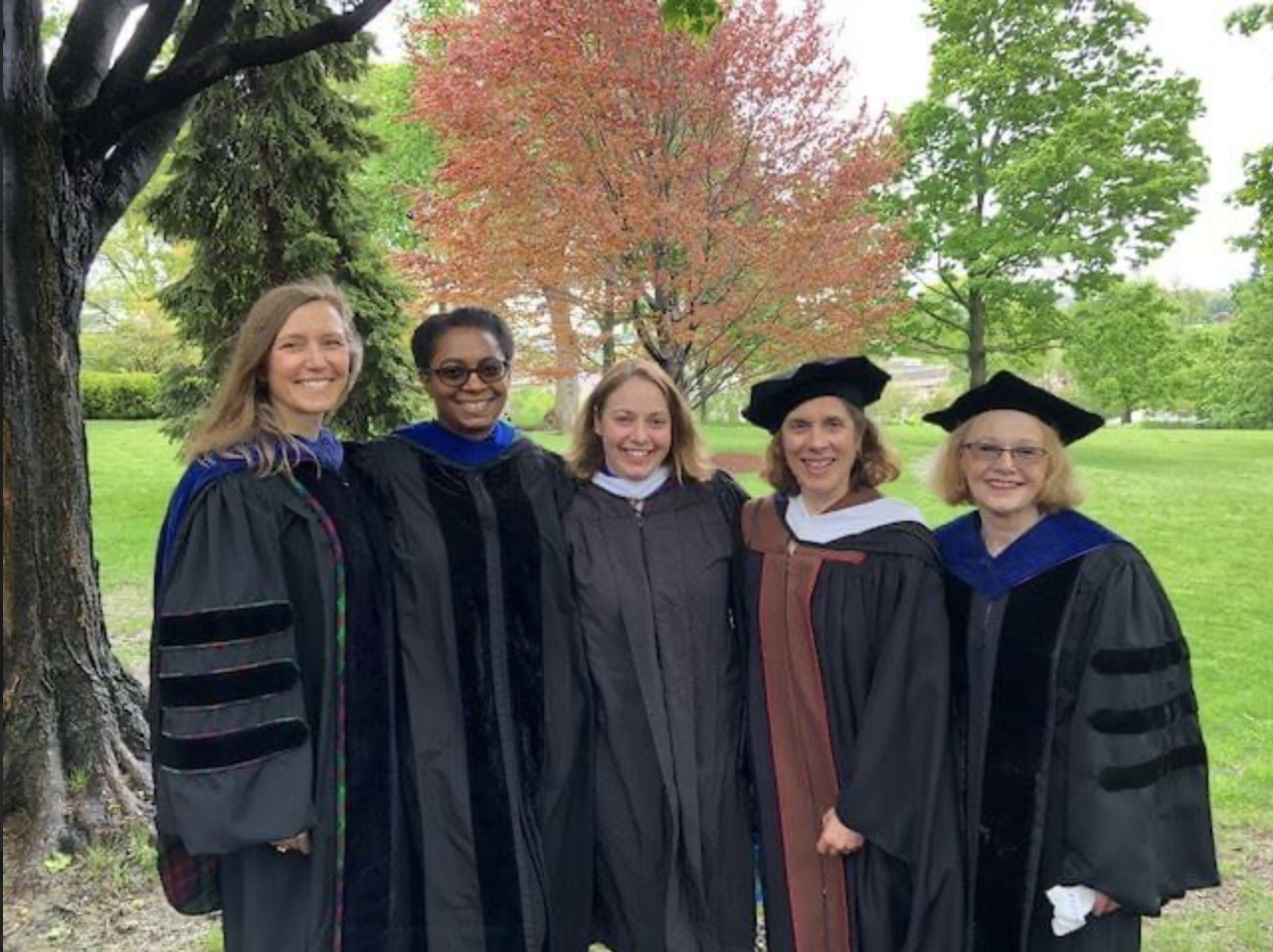 Lantern Founder Jennifer Stephan in academic regalia on campus with fellow deans.