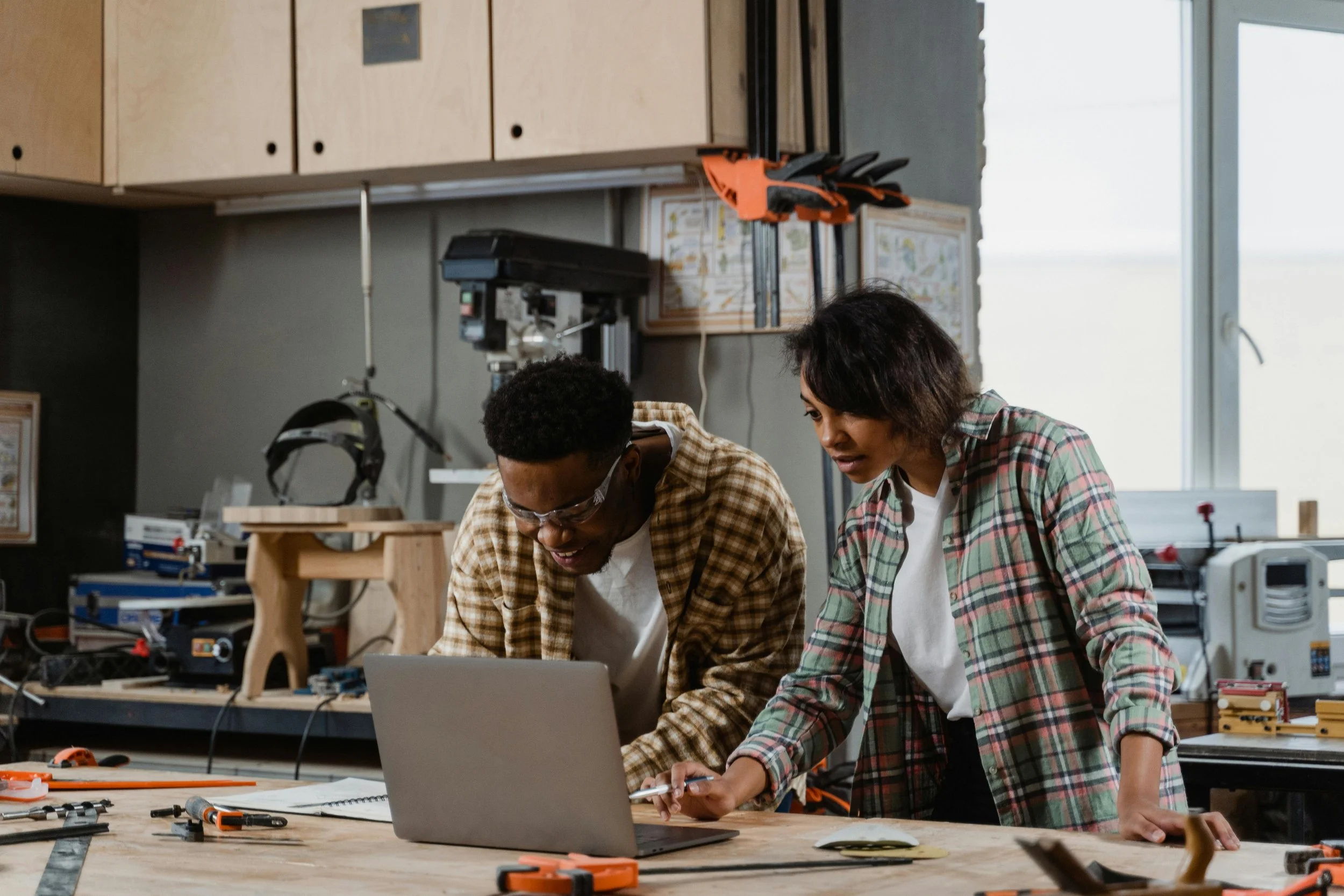 Undergraduate engineering students collaborating on a hands-on design project in a teaching-focused engineering lab