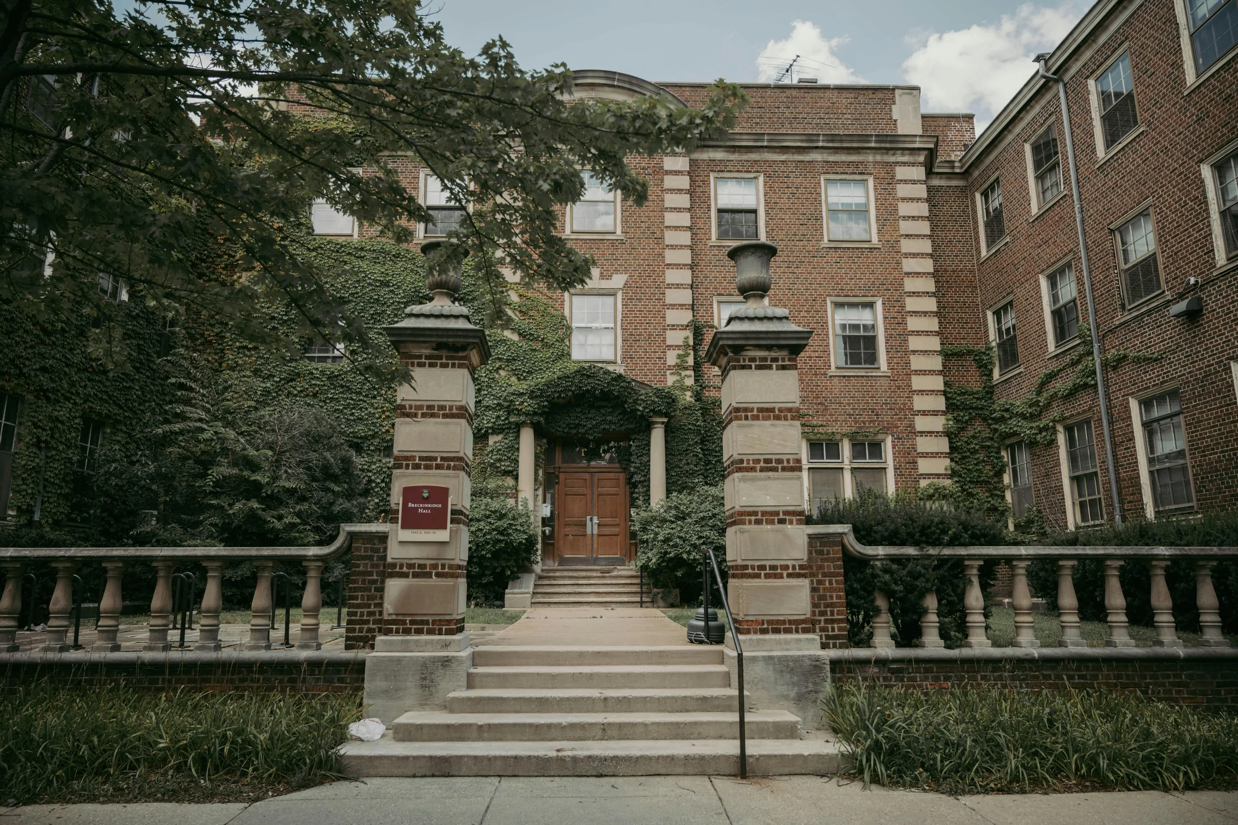 Traditional college academic building with steps and ivy, representing institutional structure and academic expectations