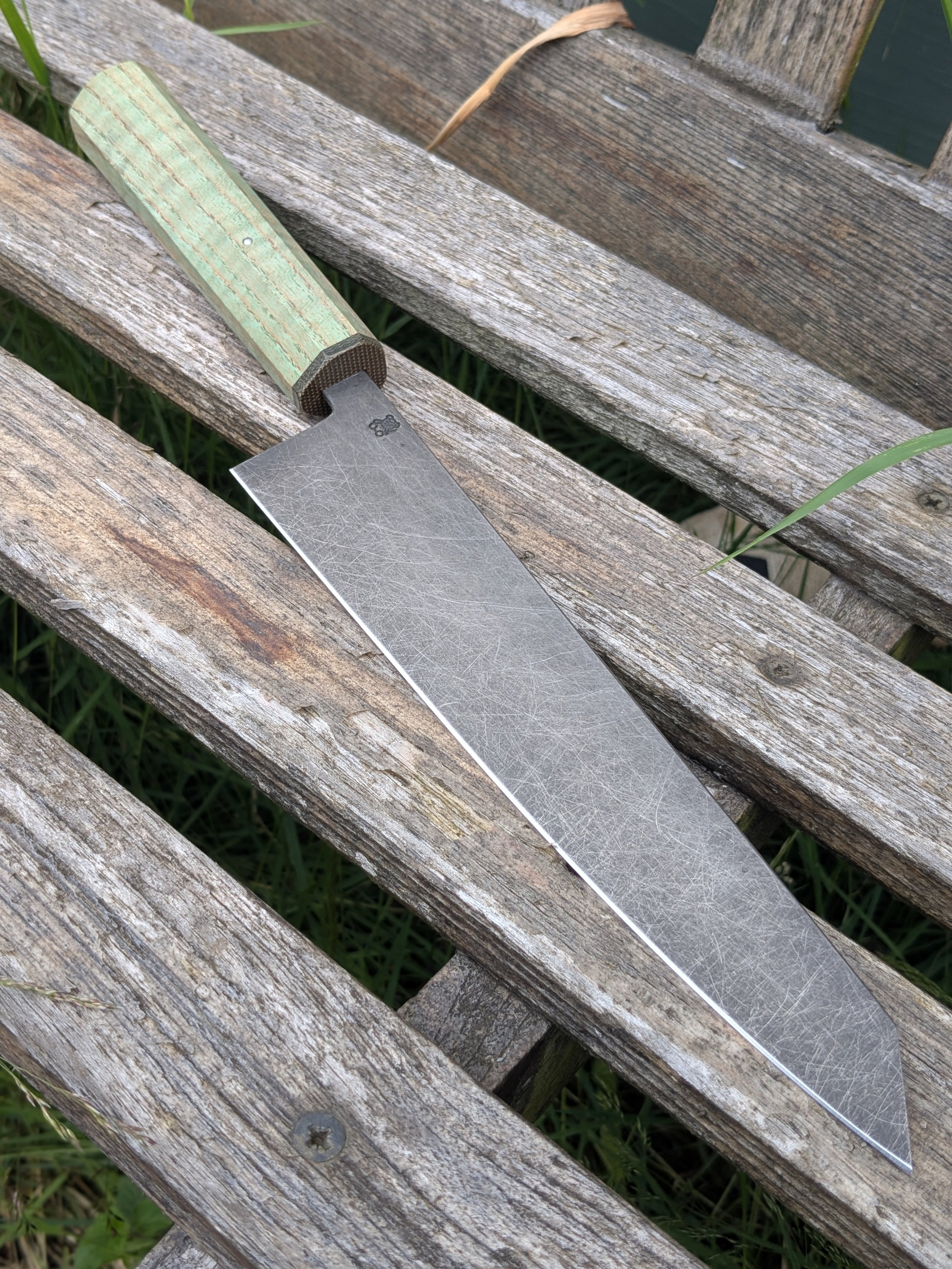 Handmade 52100 high carbon K-tip Gyuto with green ripple ash handle and stoneworn finish, made in Surrey by Teddy's Knives