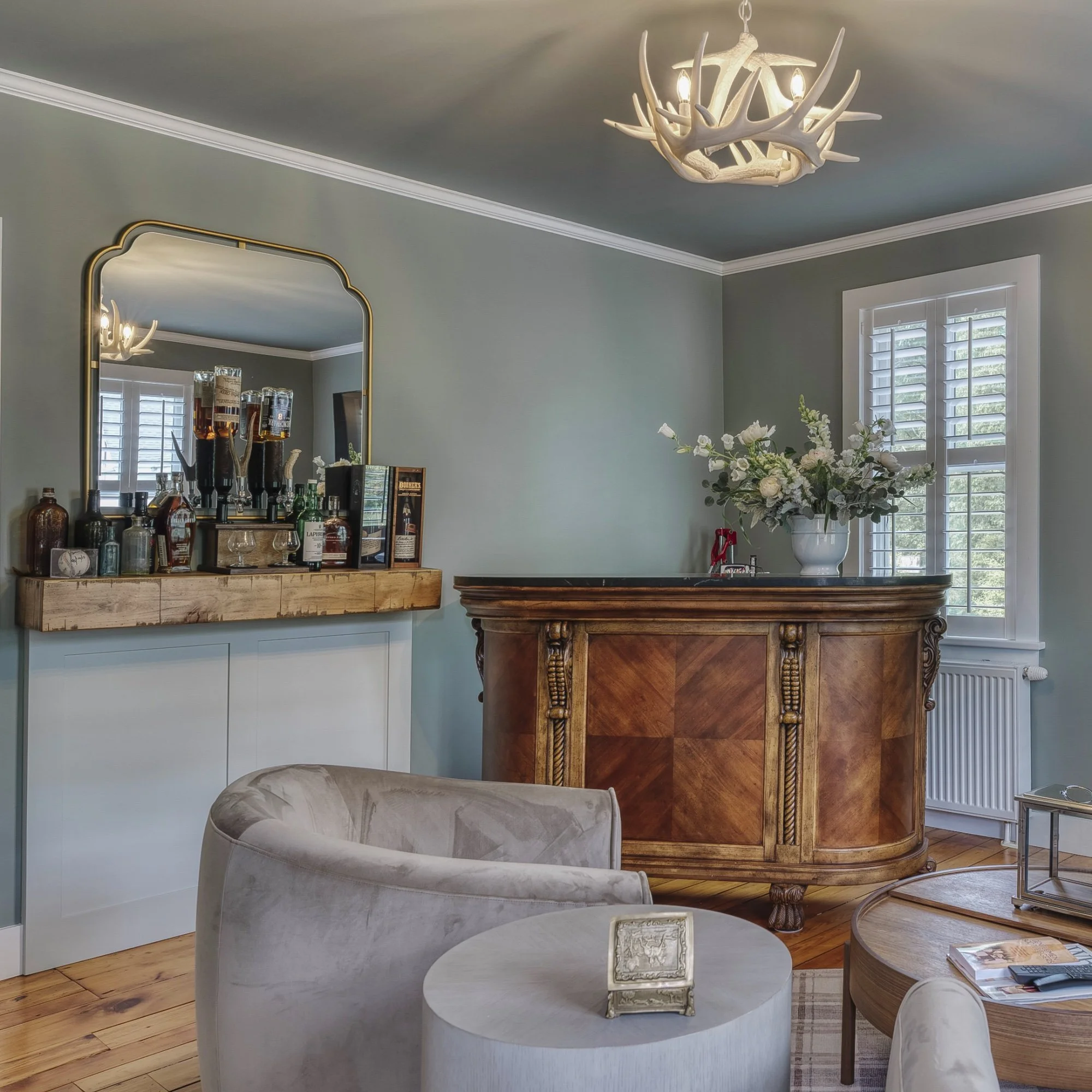 Whiskey lounge blending client's existing antiques with modern elements