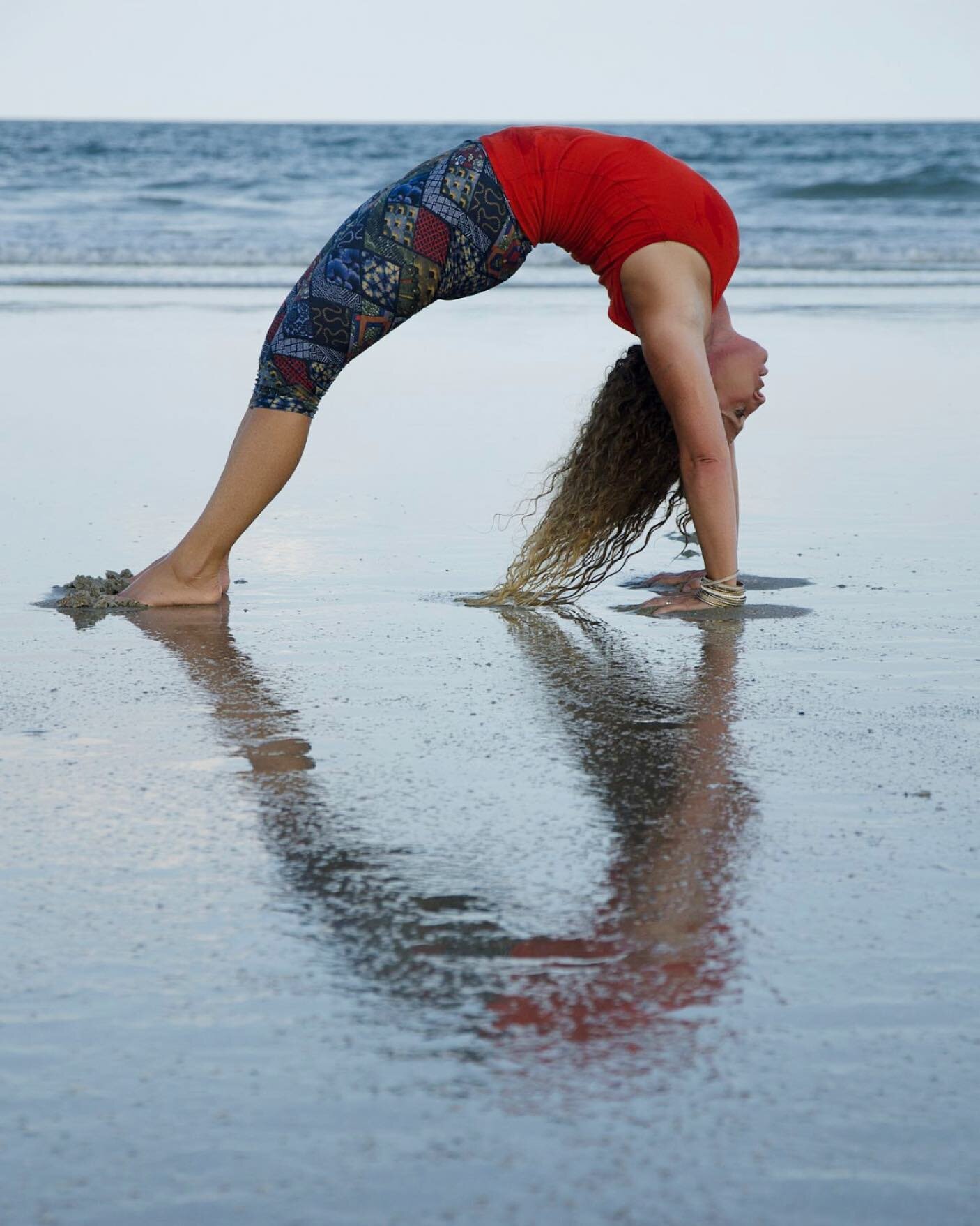 I took this photo of Christa Hicks at Saint Augustine Beach on my original Ride My Road tour in 2016. She was a beautiful person who loved yoga, her family and fighting to end trafficking. We didn&rsquo;t mean to make a heart shape with this pose but