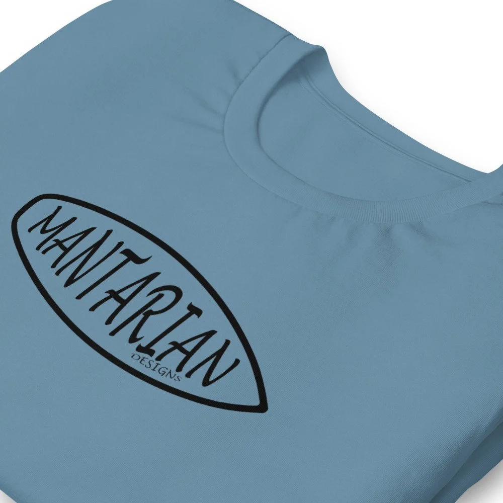 Light blue t-shirt with black text saying 'MANTRA' inside an oval shape and 'DESIGNS' below it.