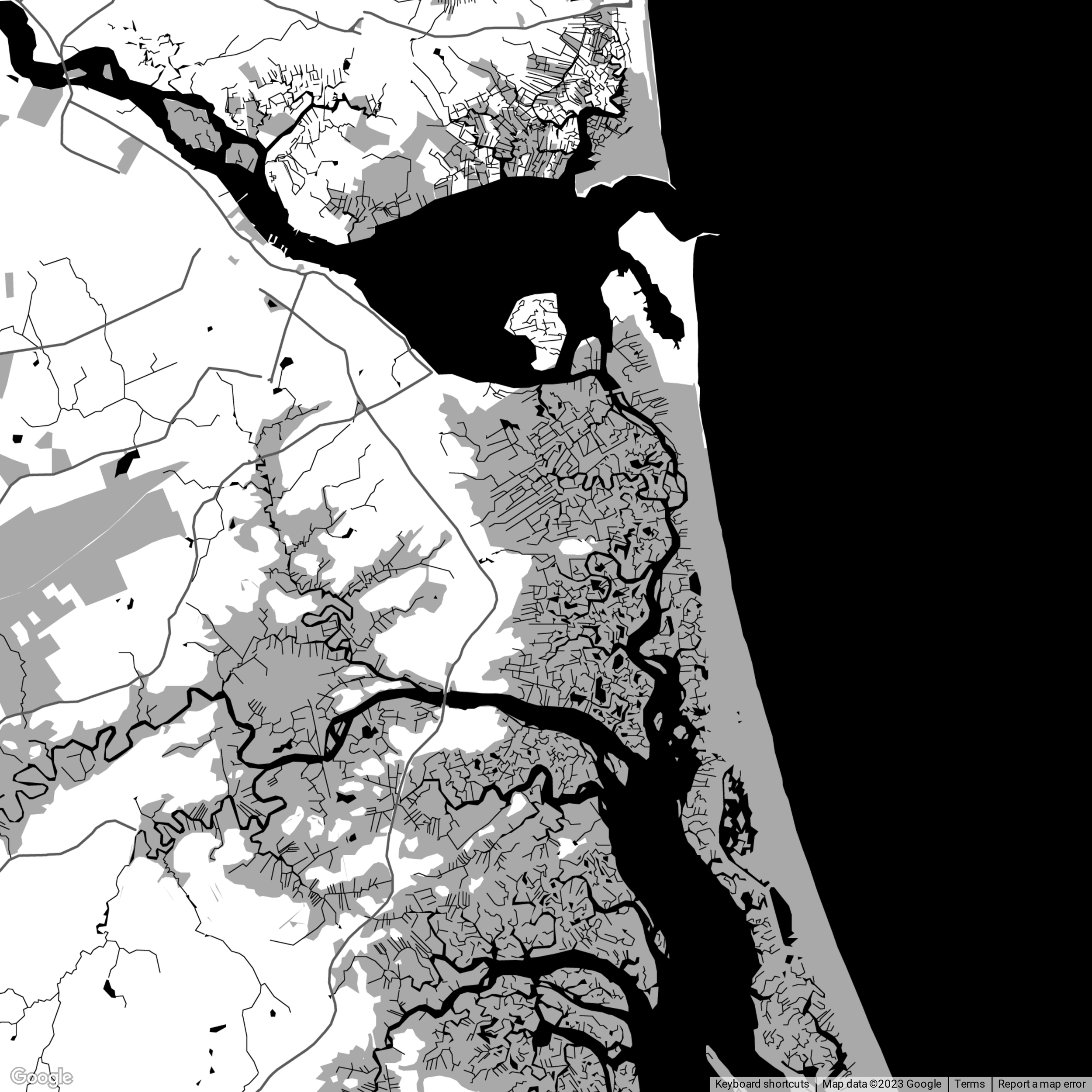 A black and white map showing a river and surrounding land with detailed street and neighborhood layouts.