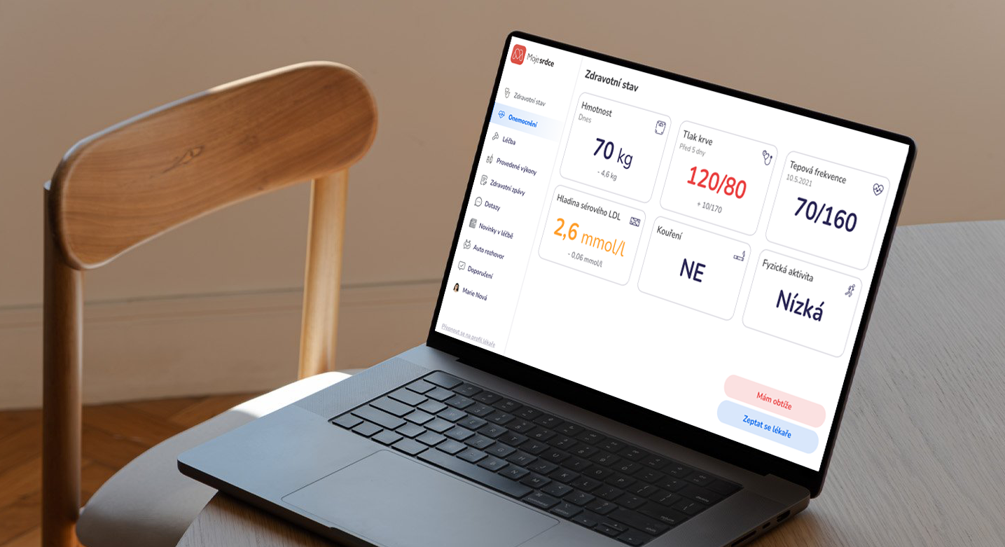 Laptop displaying a health dashboard with blood pressure, heart rate, weight, cholesterol, smoking status, physical activity, and other health metrics in Czech.