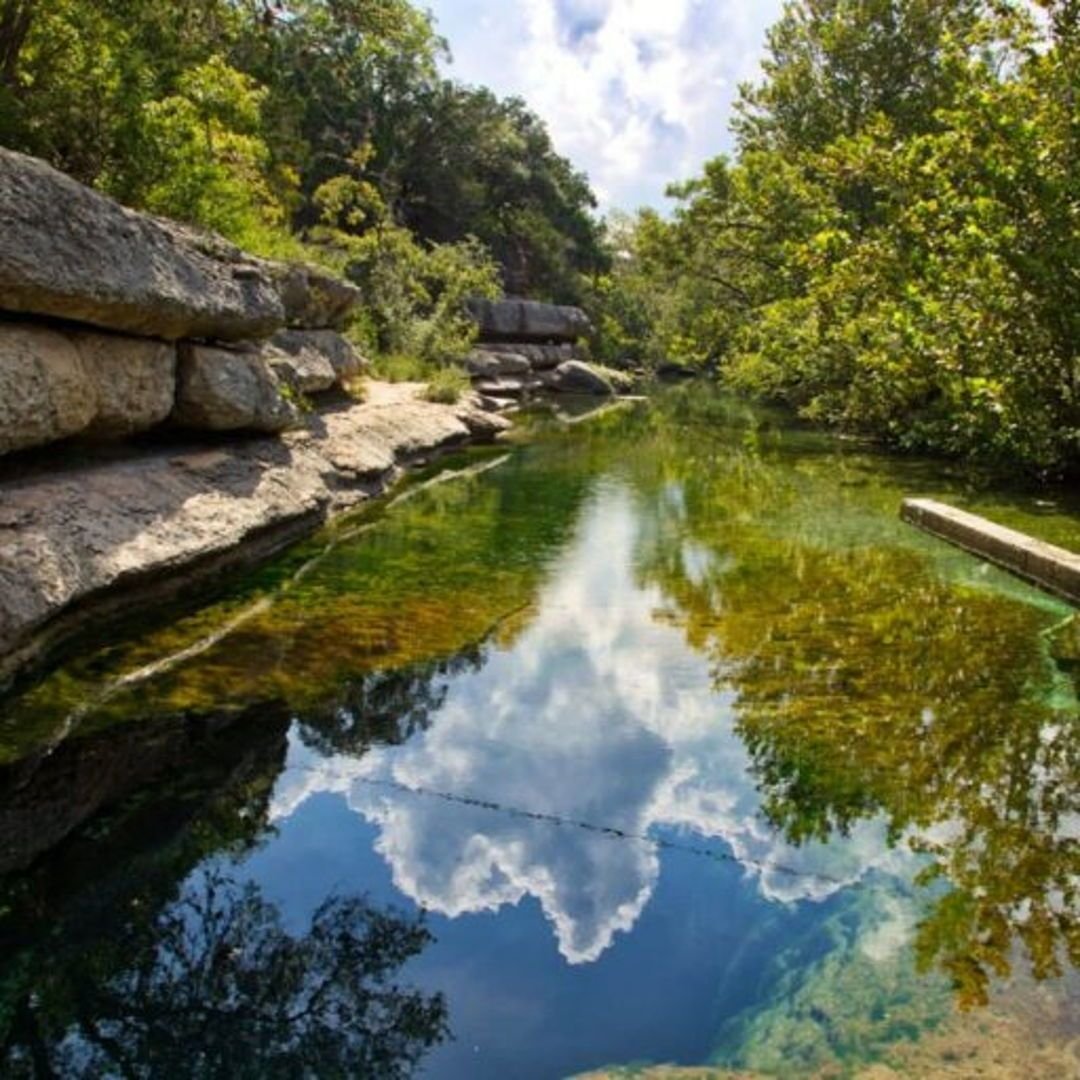 Physically on the couch, but mentally here. 
Take a dip in a mysterious 130-foot spring-fed wonder.🏊&zwj;♂️ Jacob's Well is a natural wonder with crystal-clear water, perfect for cliff jumping and underwater exploration. Just be sure to check water 