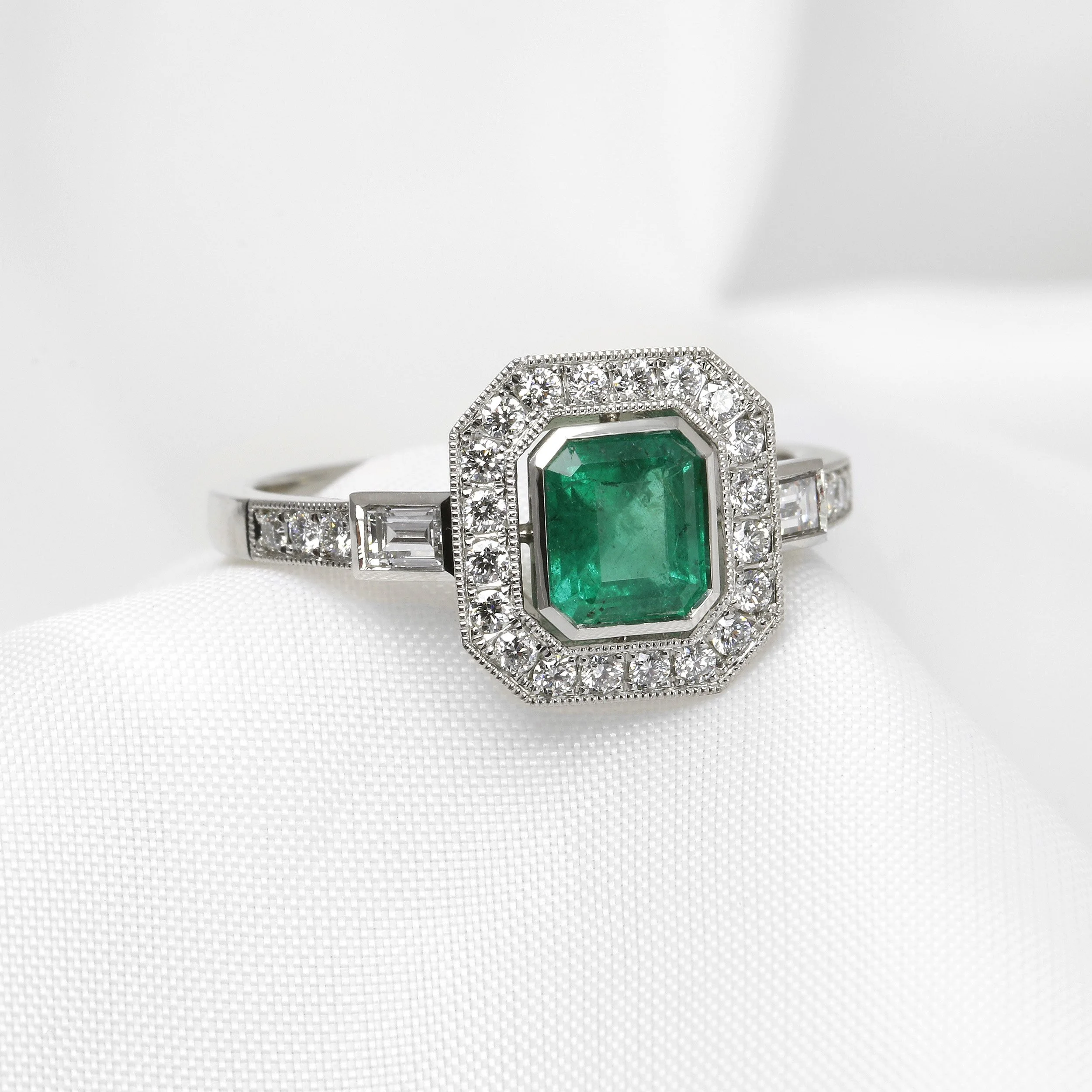  Emerald and Diamond Halo Ring in Platinum £2,750.00 