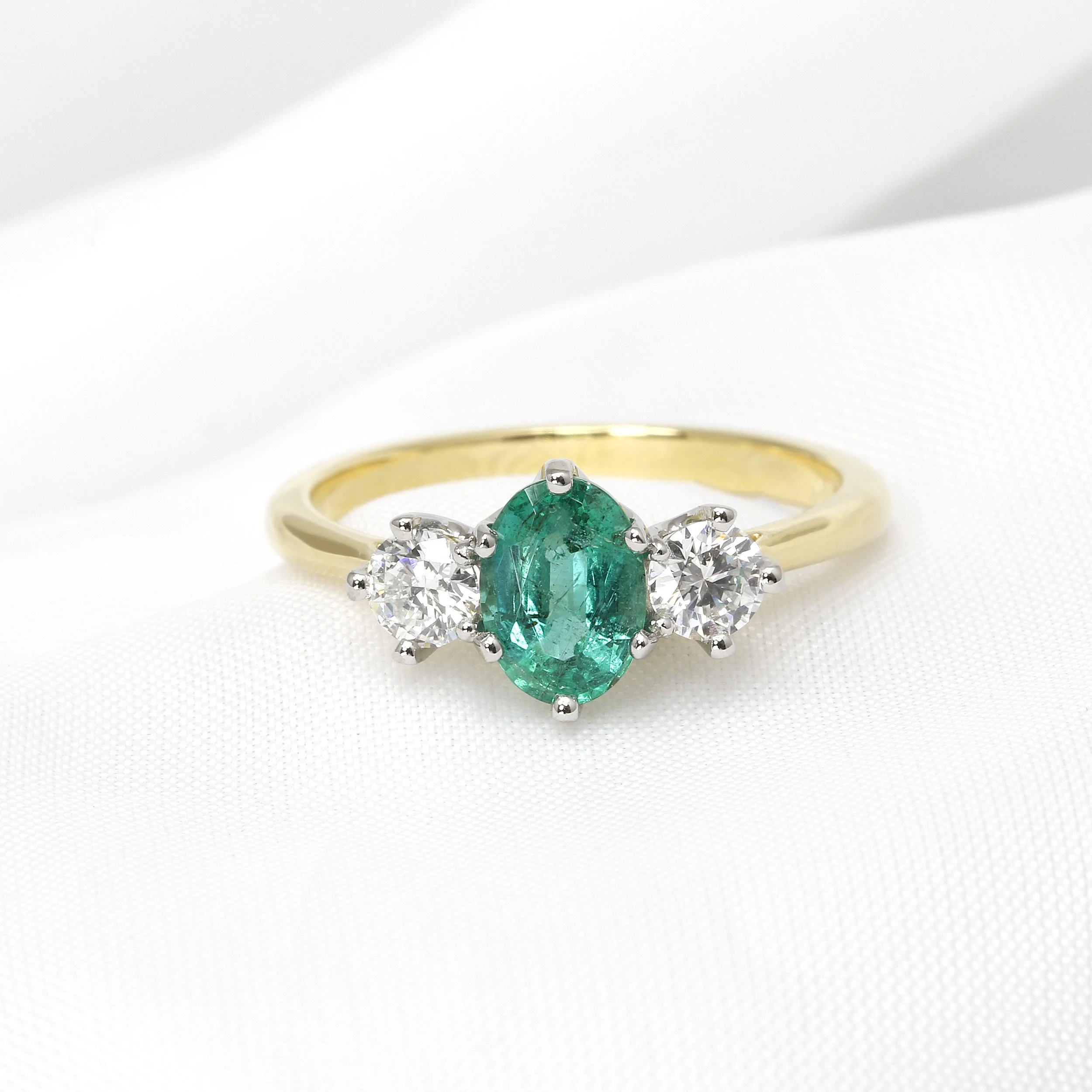 Oval Emerald and Diamond Three Stone Ring in Yellow Gold and Platinum