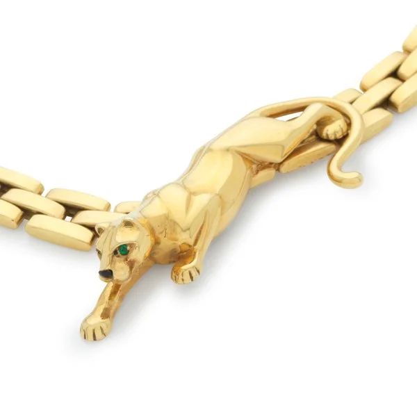   The famous Cartier Maillon Panthère necklace (circa 1980) in 18k yellow gold with circular-cut emeralds and enamel,&nbsp;   estimate $8,500–$13,000    at auction   