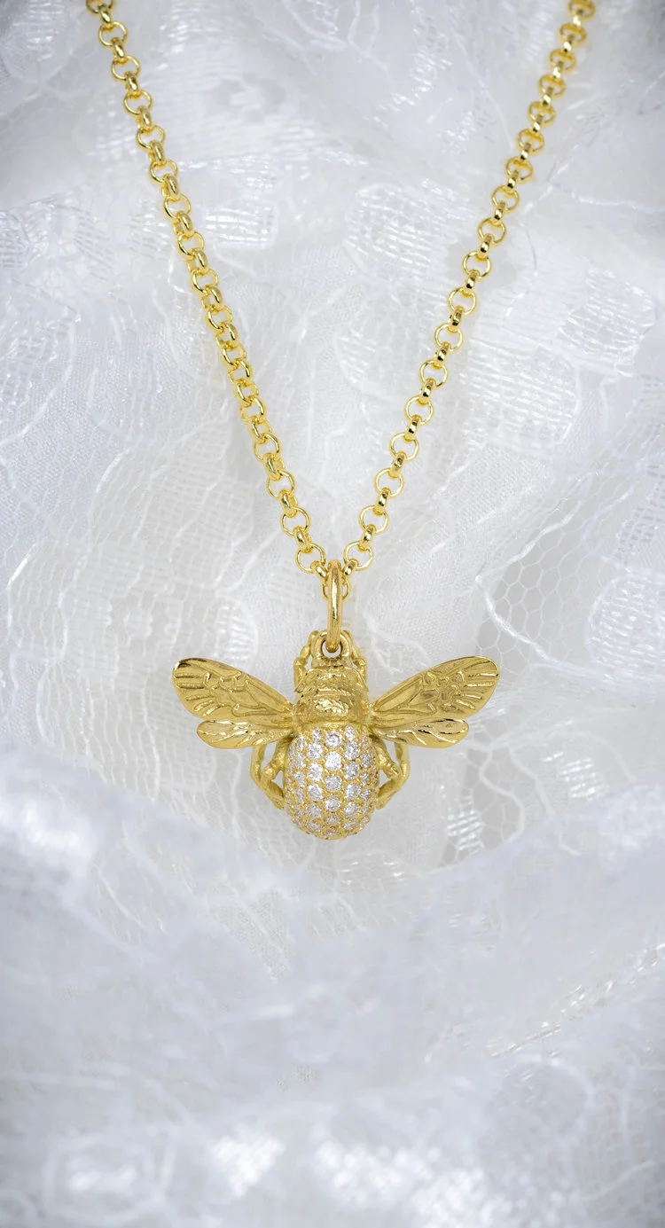  18ct yellow gold bee pendant with pave diamond set abdomen. Made by Timothy Roe, Chichester, England. 
