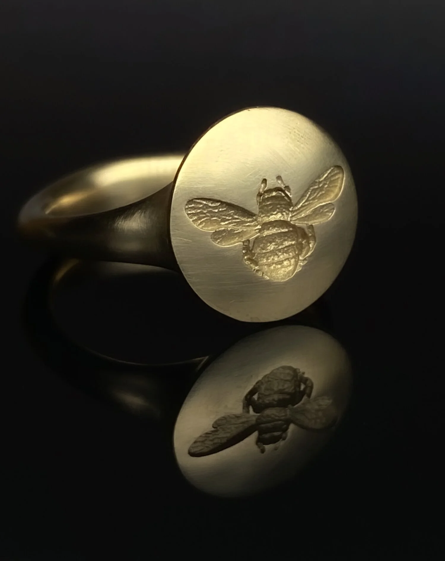  The Timothy Roe Roman-style Bee ring. This one with a satin finish rather than the usual polished finish. From £475 in 9ct yellow, rose or white gold. Also available in 18ct and platinum. These are one of the very few items that are not truly bespoke as we have have one master CAD pattern that is sized on a computer before being 3d printed in wax and then cast and hand finished in our workshop. However, adjustments can be made to weight, shape of head (it could be made oval for instance) before printing which gives you more of a bespoke ring. Made in Chichester, England. For an up-to-date quote for your finger size click  here.  