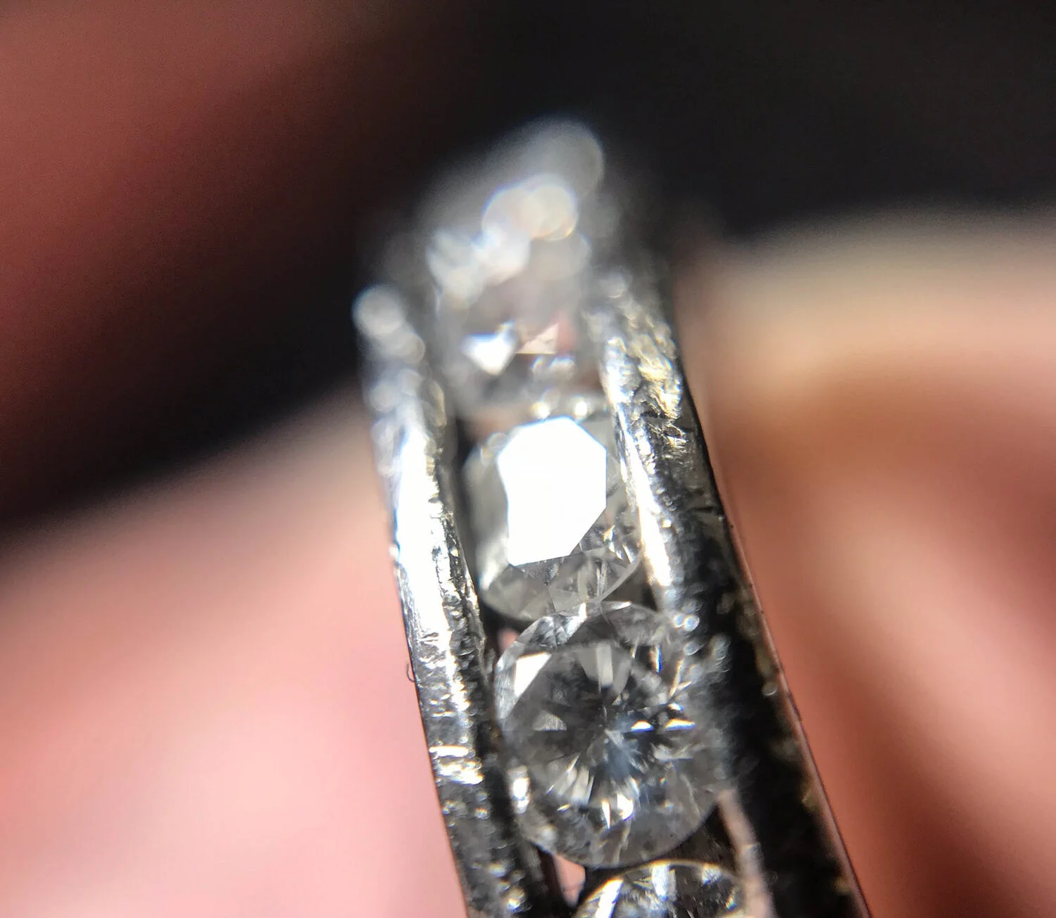  Image 2. Here we can see impact marks from a sharp long edge. The depressions are however smooth which shows it is likely to have been a polished surface rather than something like a piece of rough stone or something abrasive. There are many, many impact marks and it is not surprising that at least one of the diamonds has been broken (centre of image). 