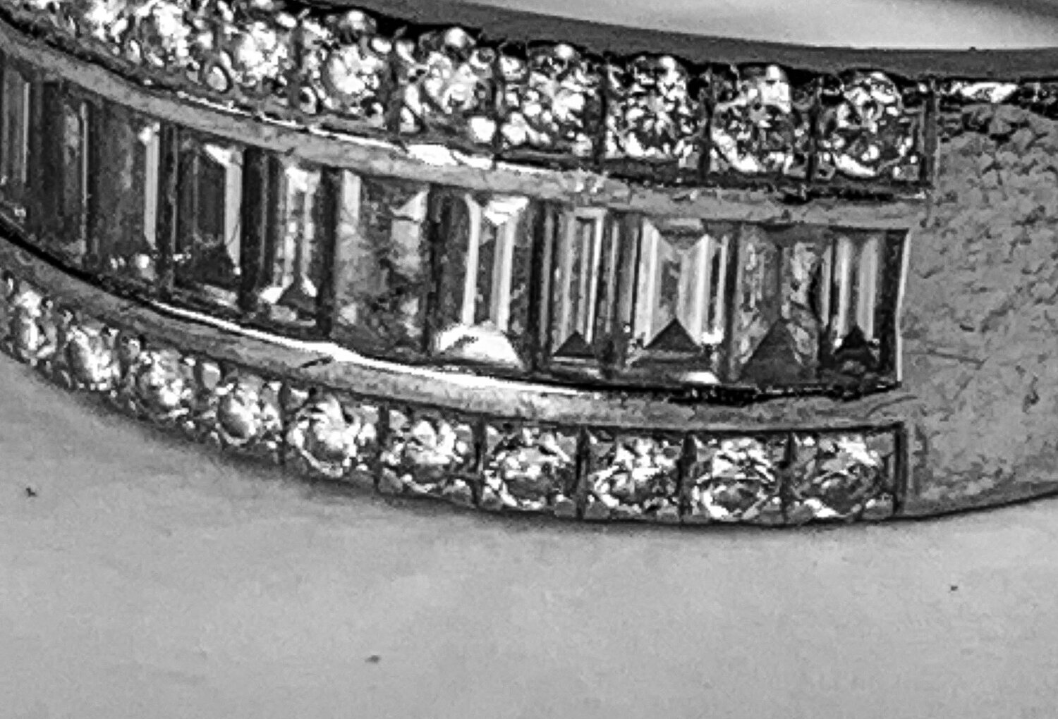  Image 10. This looks like another example of enthusiastic applause whilst wearing a ring on each hand. Broken diamonds and many impact marks from the other ring. 