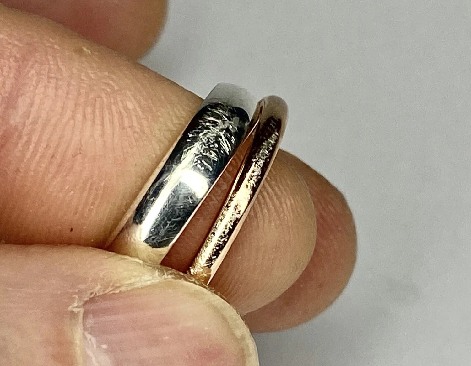  Image 14. A silver and a gold on silver, once perfectly polished bands, after a short visit to the gym. 