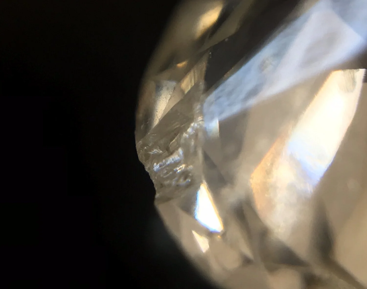  Image 17 and 18. Two images of the same old European cut diamond where the top view hardly shows the chip but the bottom view shows how it can spread down the pavilion, sometimes right down to the culet. 