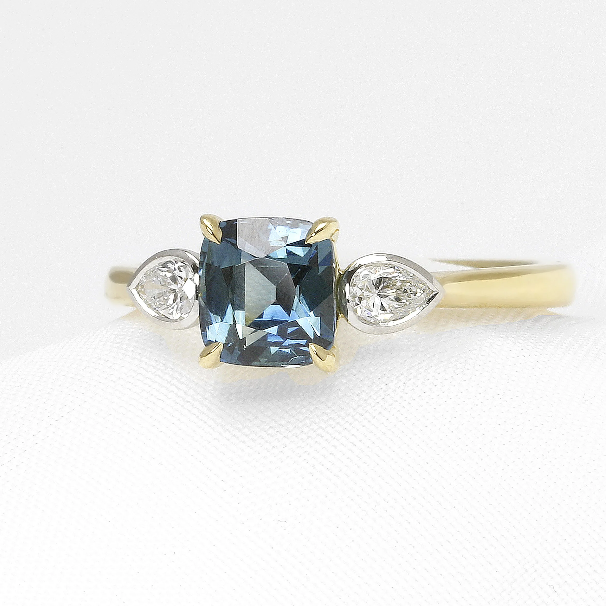  Teal sapphire and diamond three stone ring in yellow gold and platinum  