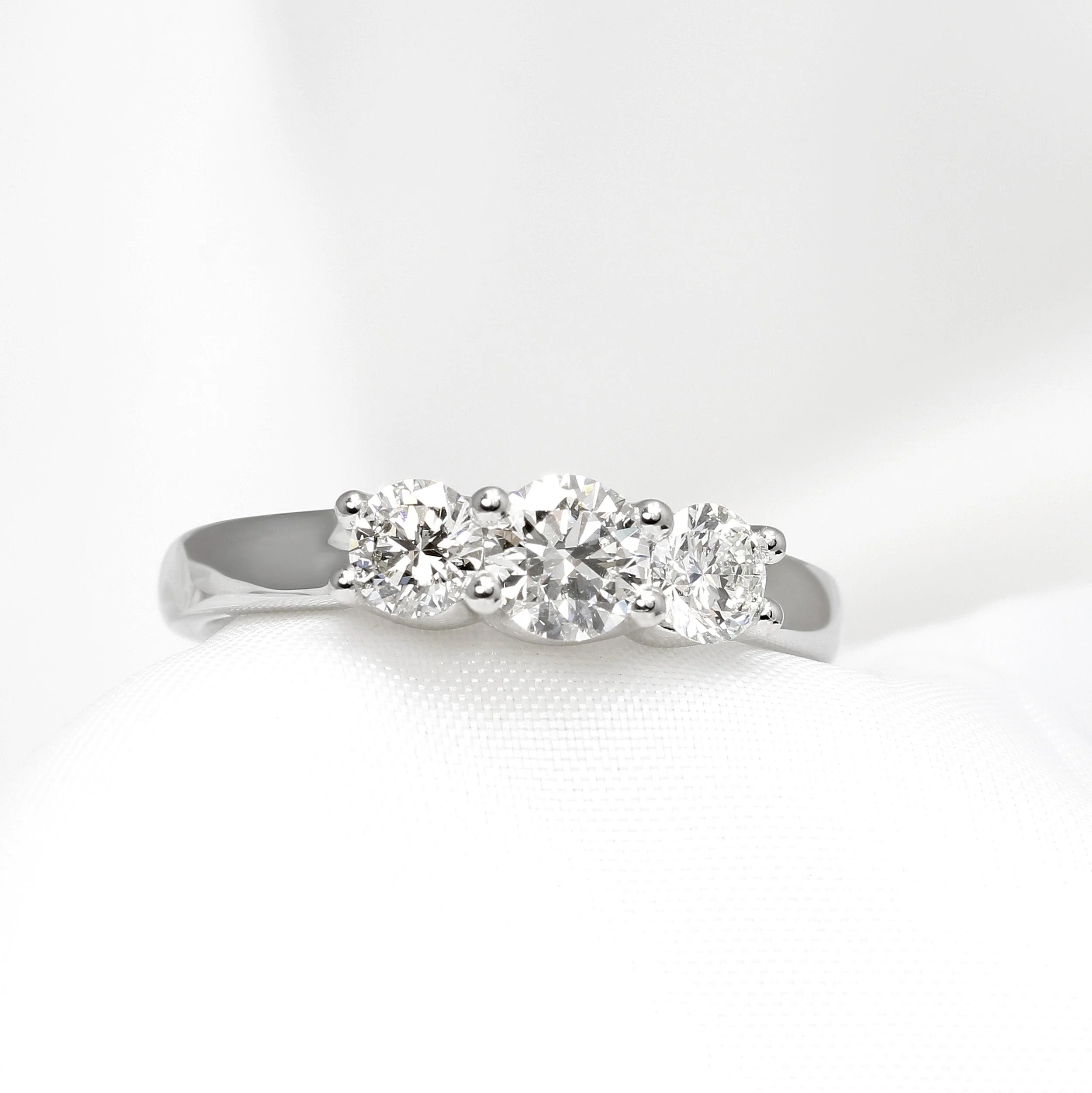  Three stone diamond ring in u-claw setting in platinum  