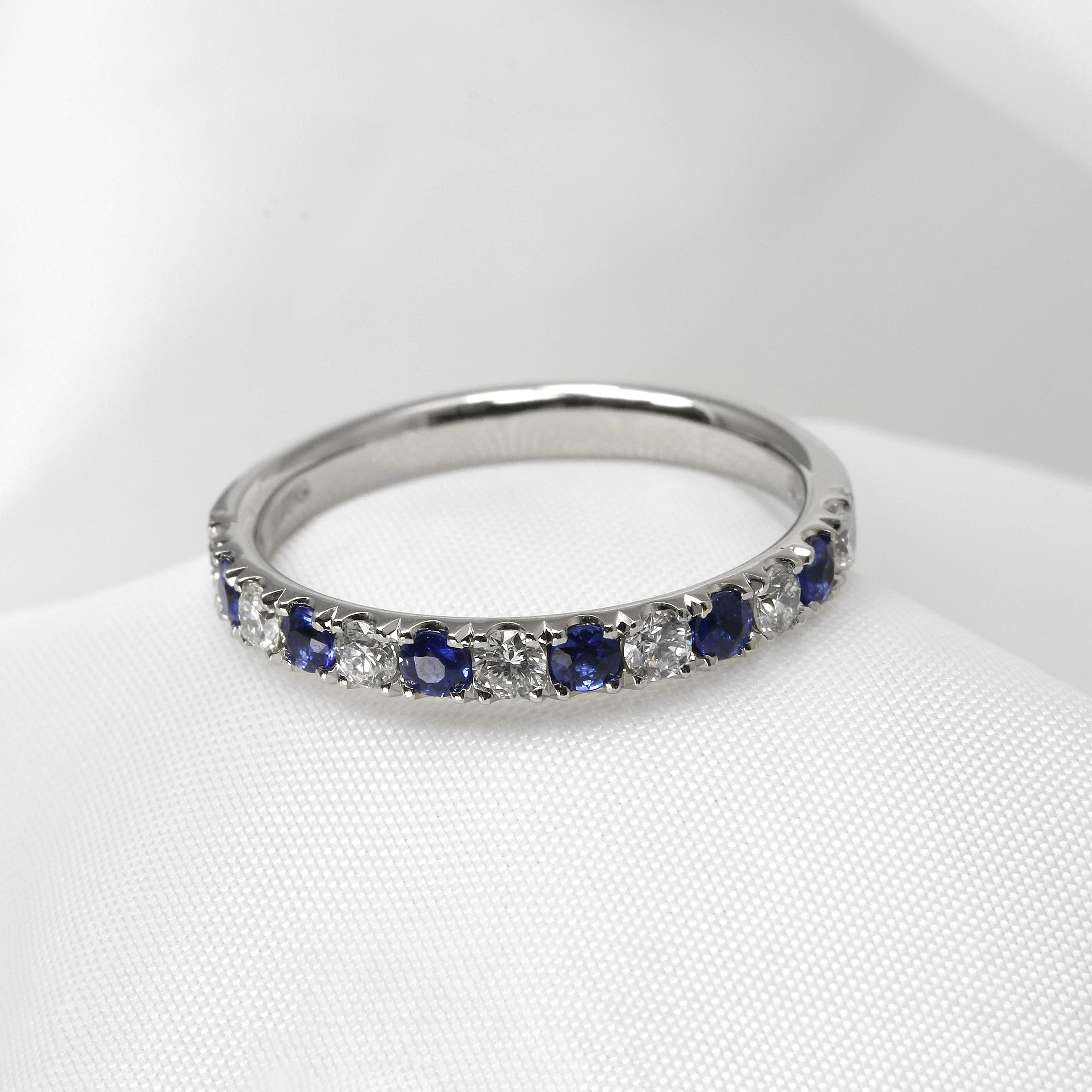 Sapphire and Diamond Half Eternity Ring in Platinum