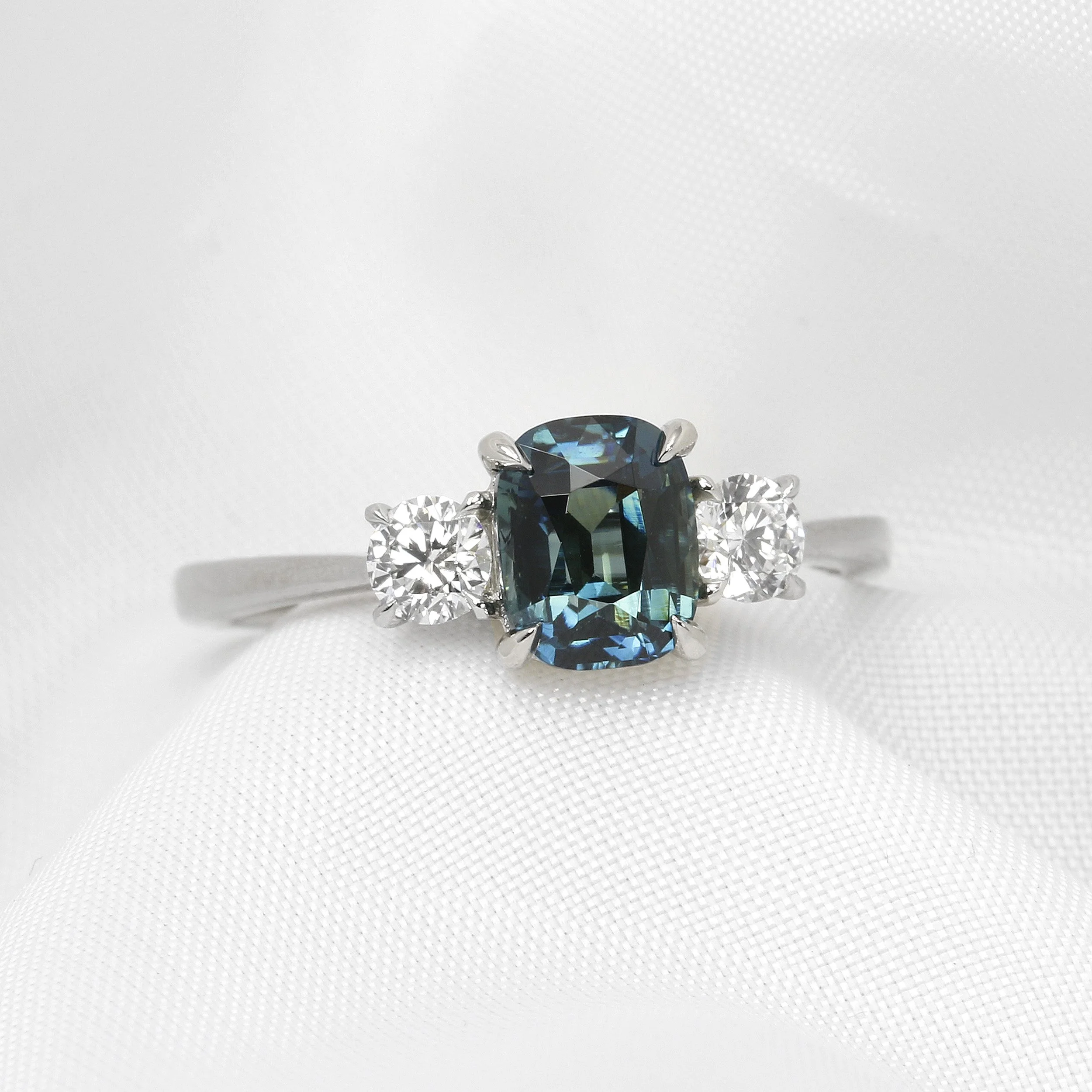 Teal Sapphire and Diamond Three Stone Ring in Platinum