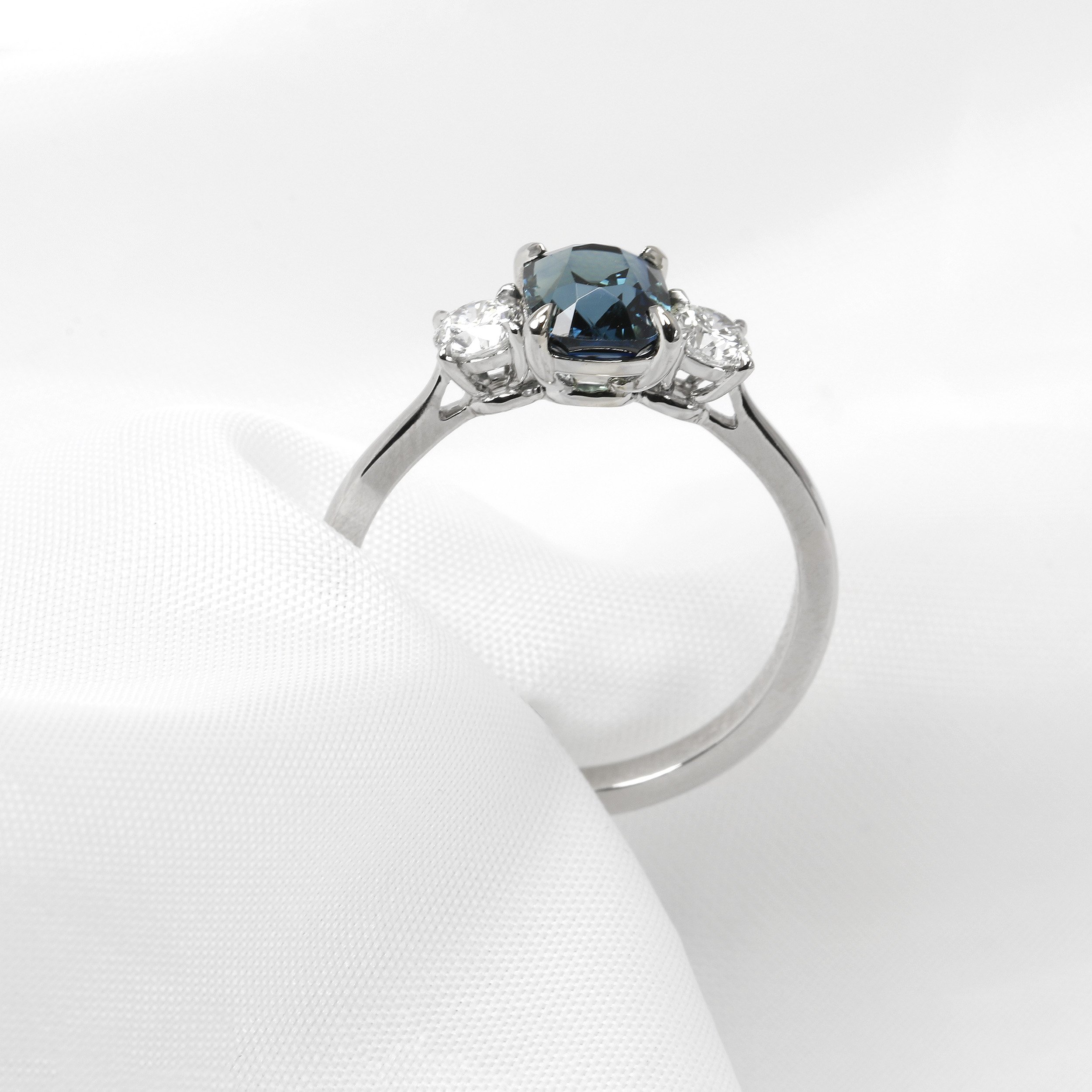 Teal Sapphire and Diamond Three Stone Ring in Platinum
