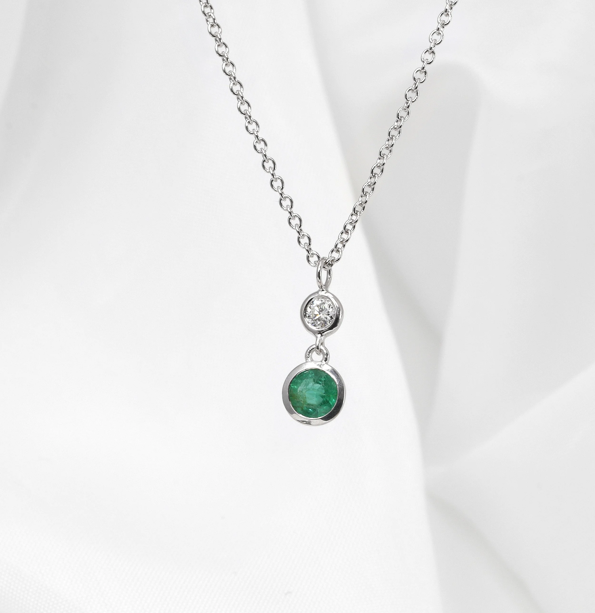 Emerald and Diamond Drop Pendant in White Gold