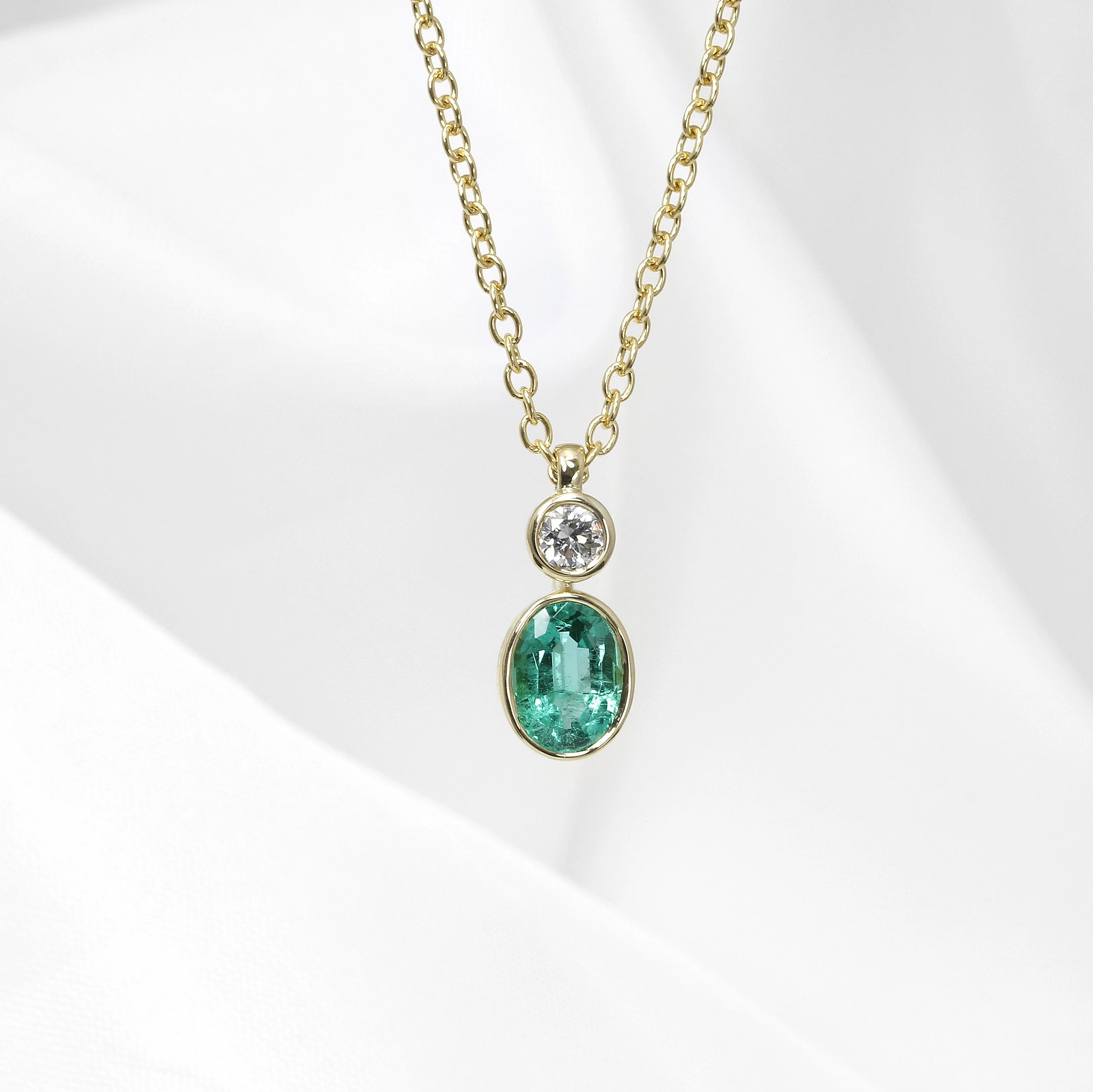 Emerald and Diamond Pendant in 9ct Yellow Gold
