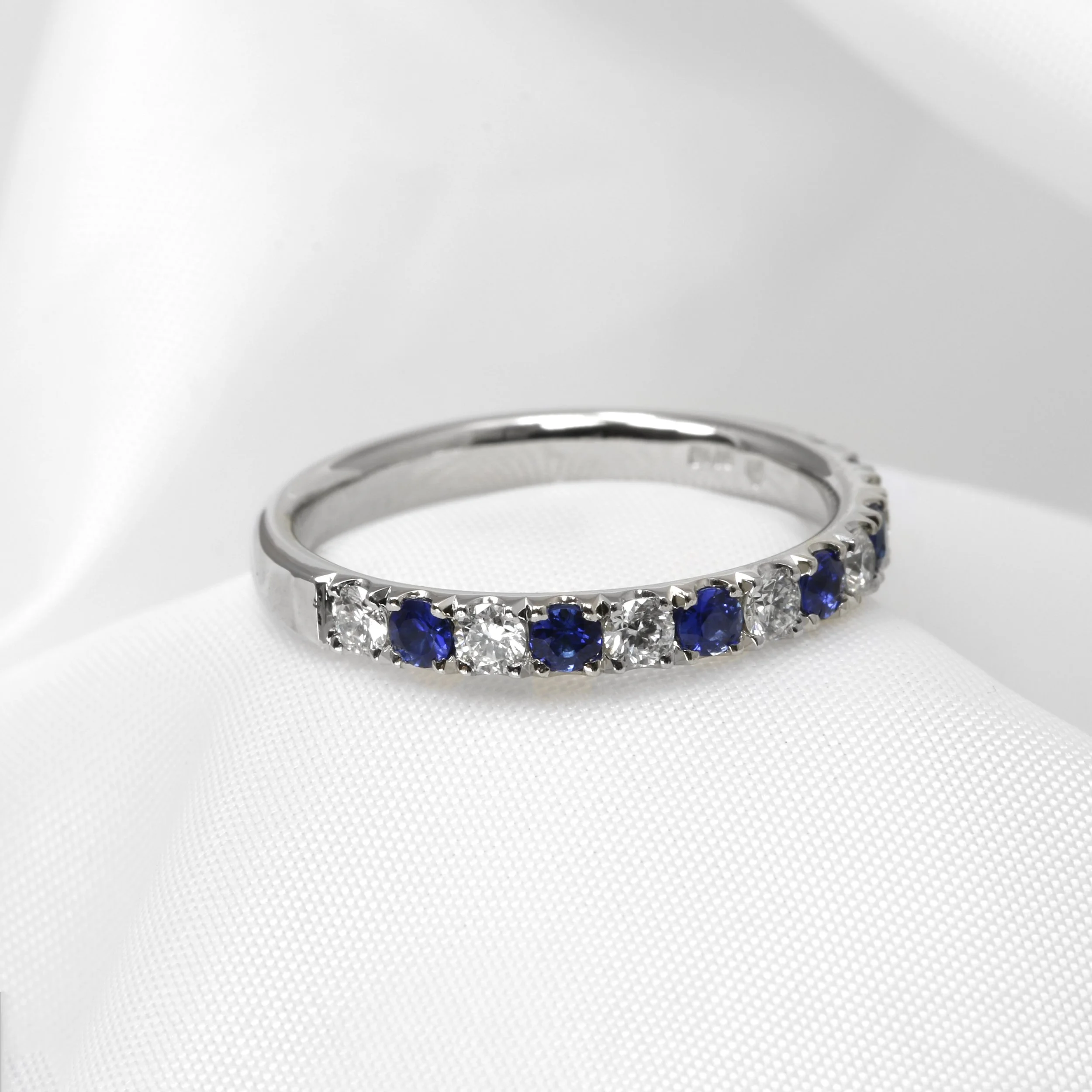 Sapphire and Diamond Half Eternity Ring in Platinum