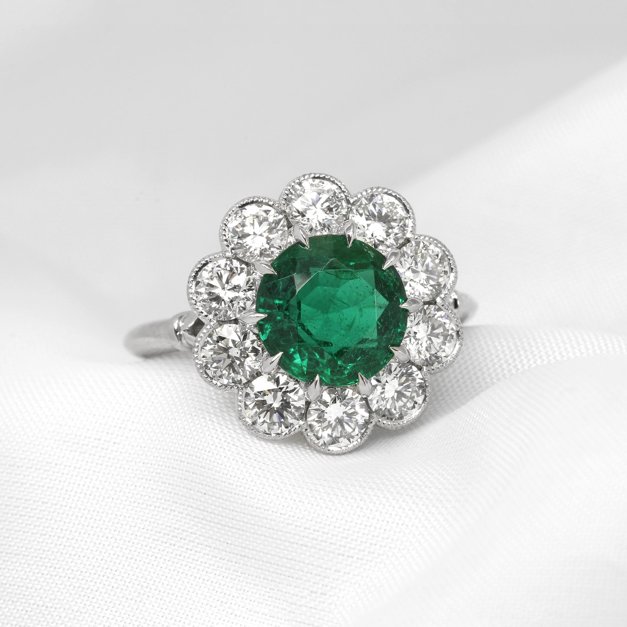  Timothy Roe Emerald and Diamond Daisy Cluster Ring in Platinum £14,995.00 