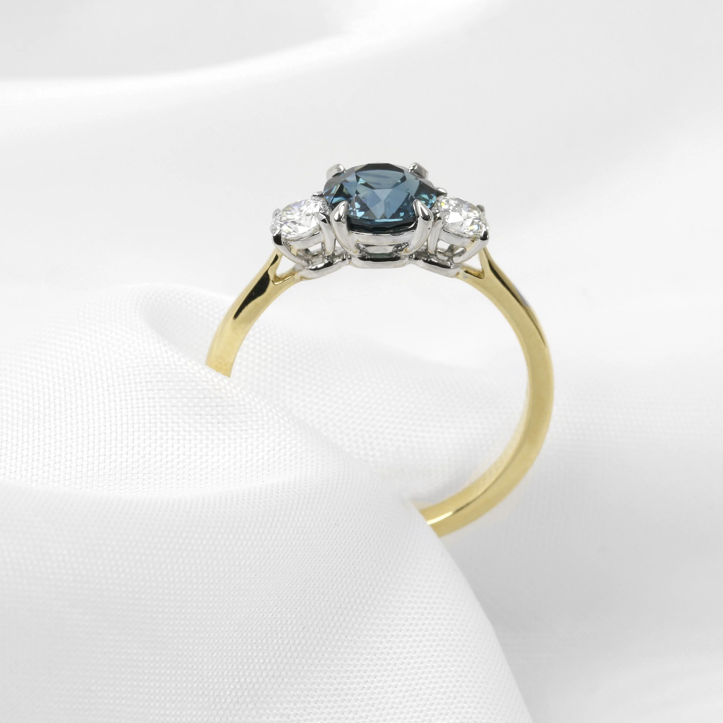 Teal Sapphire and Diamond Three Stone Ring in Platinum and 18ct Yellow Gold