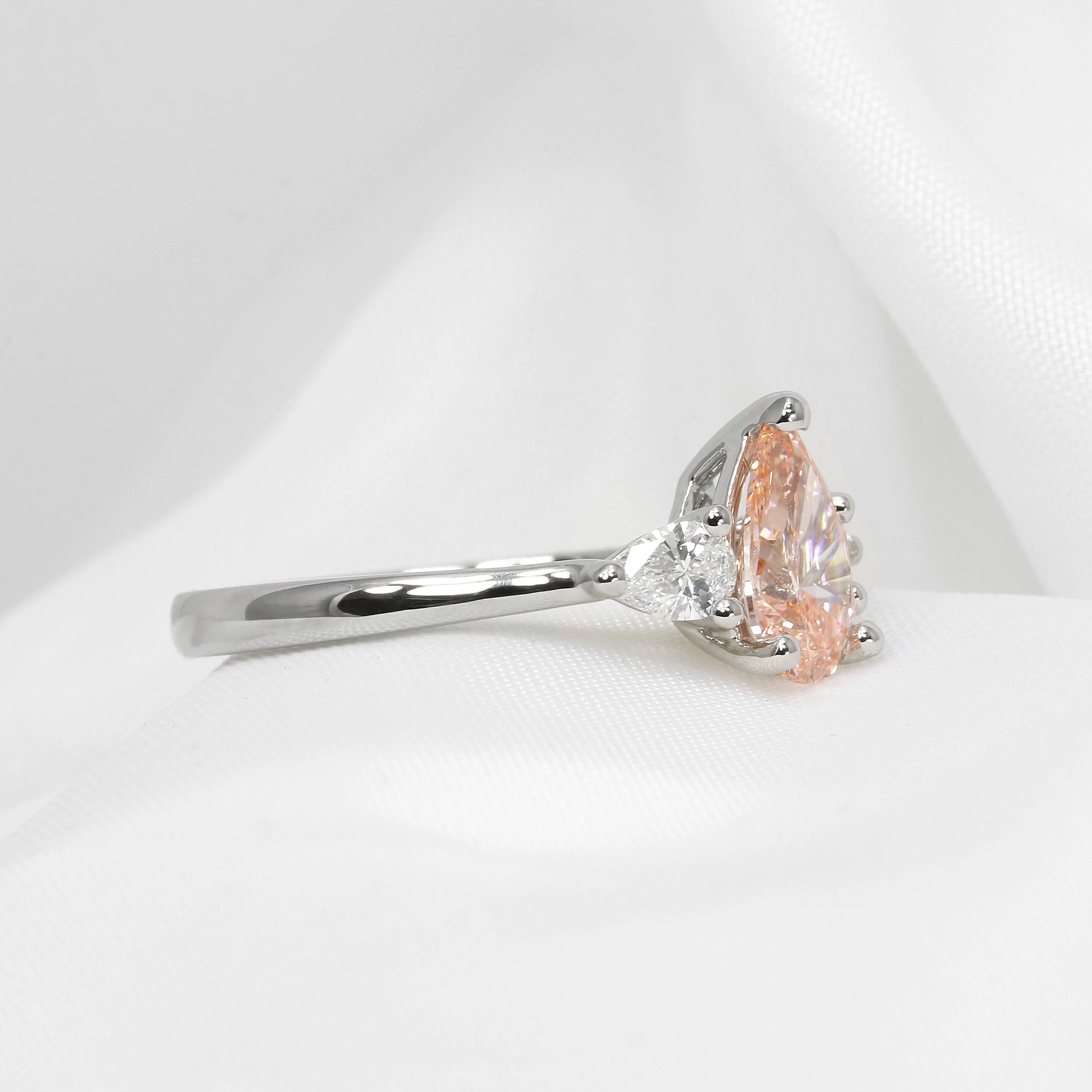 Lab Created Pink Pear Shape Diamond Three Stone Ring