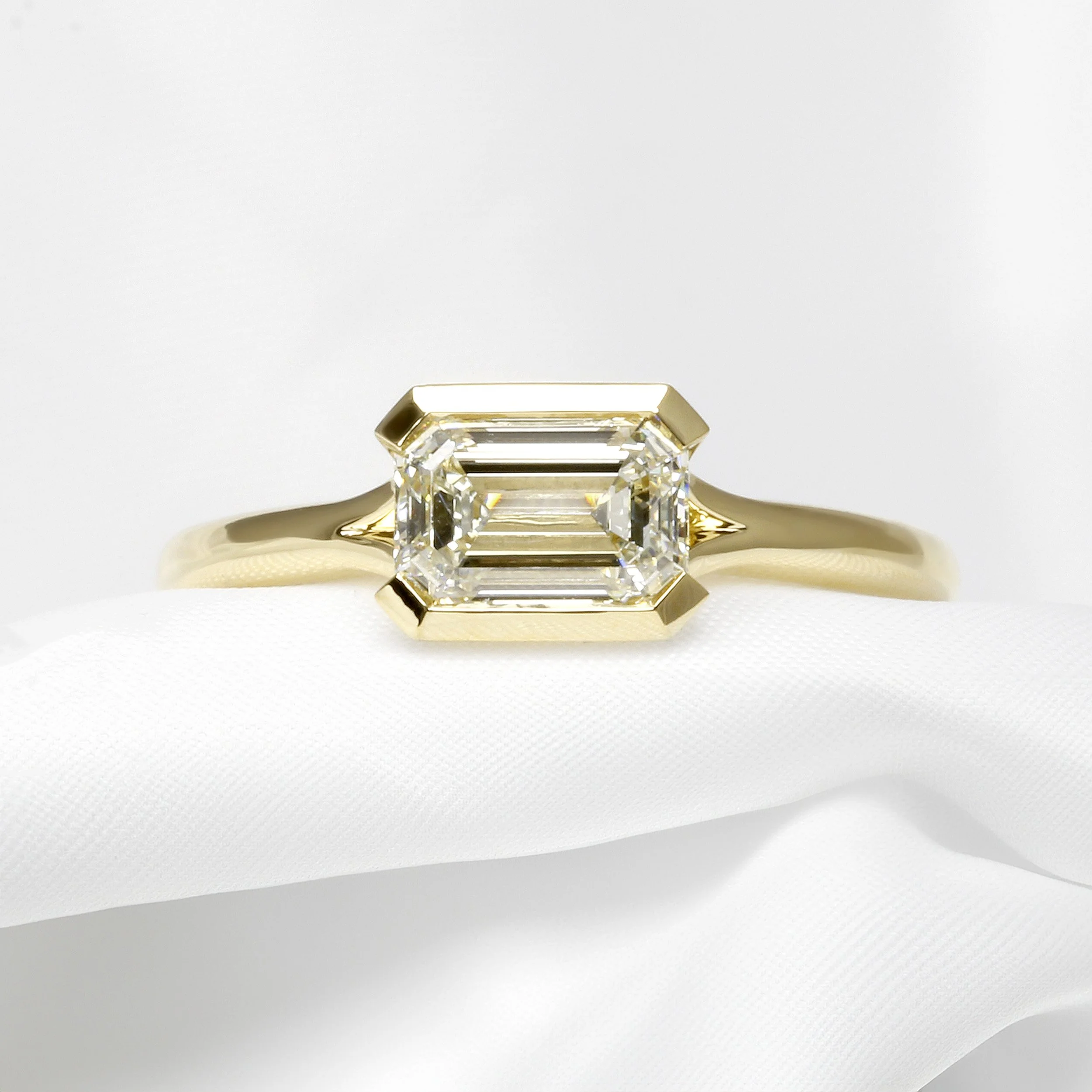  A Step Cut or Emerald Cut Diamond in Yellow Gold 