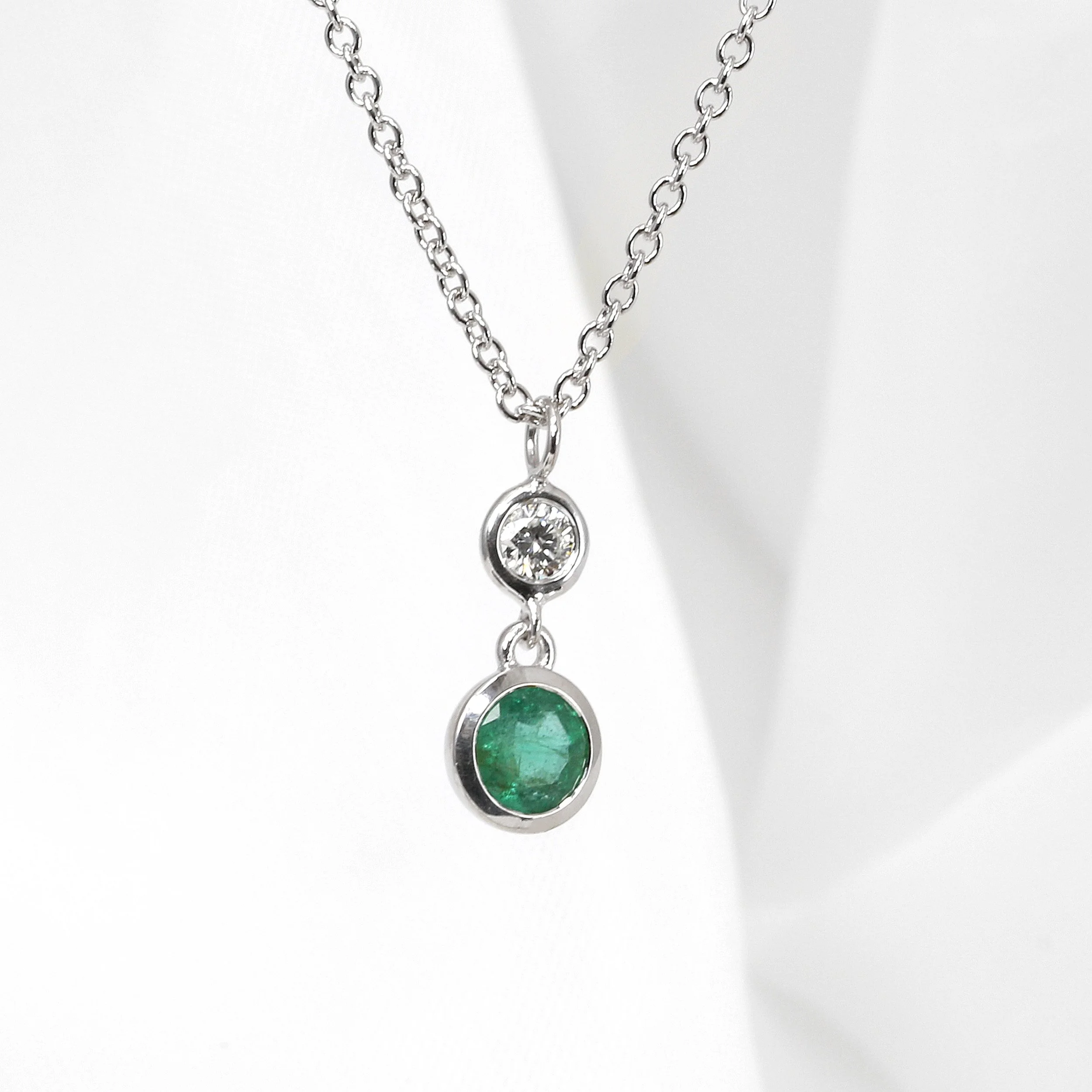Emerald and Diamond Drop Pendant in White Gold